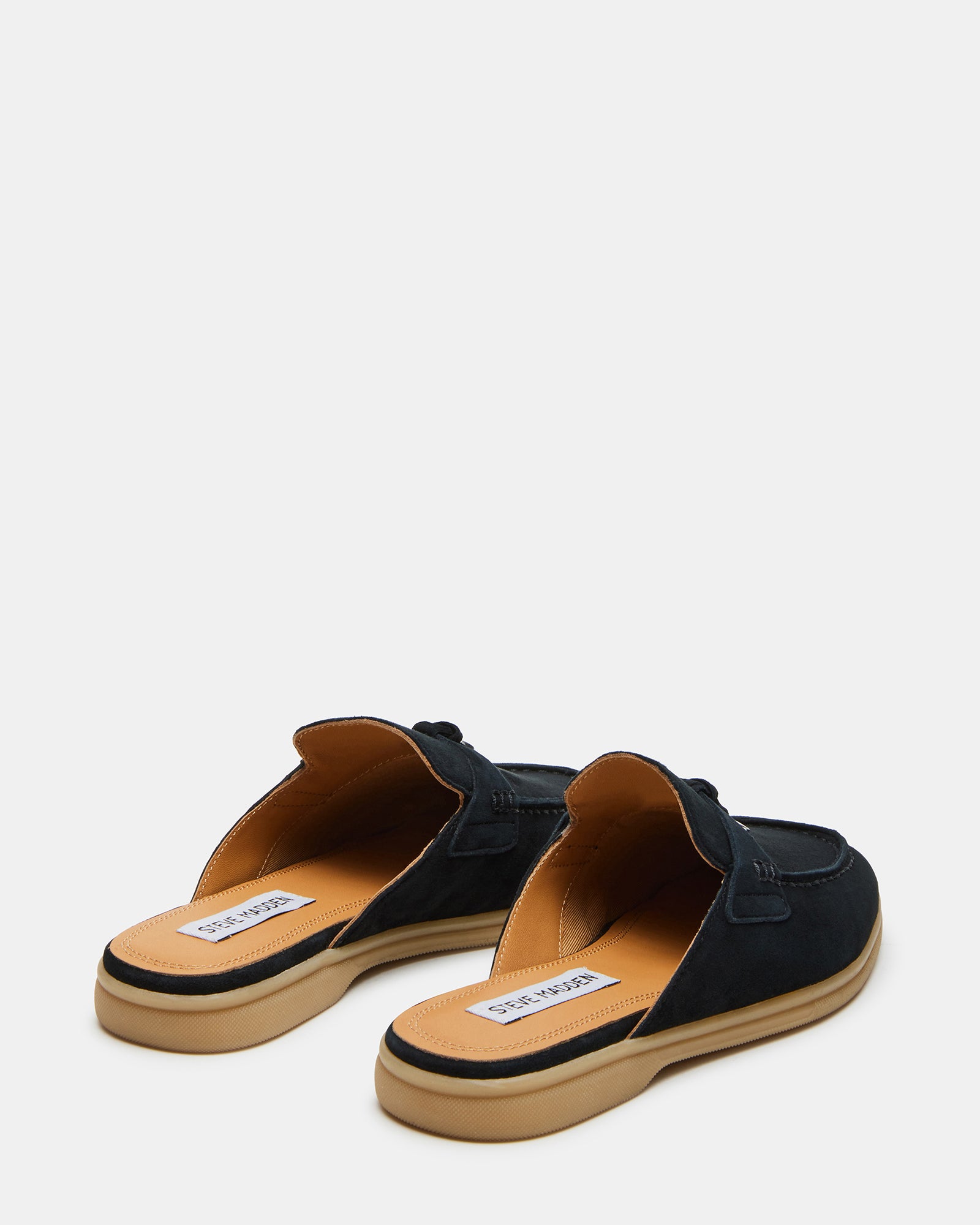 Side angle of disc charm detail on black mules for women
