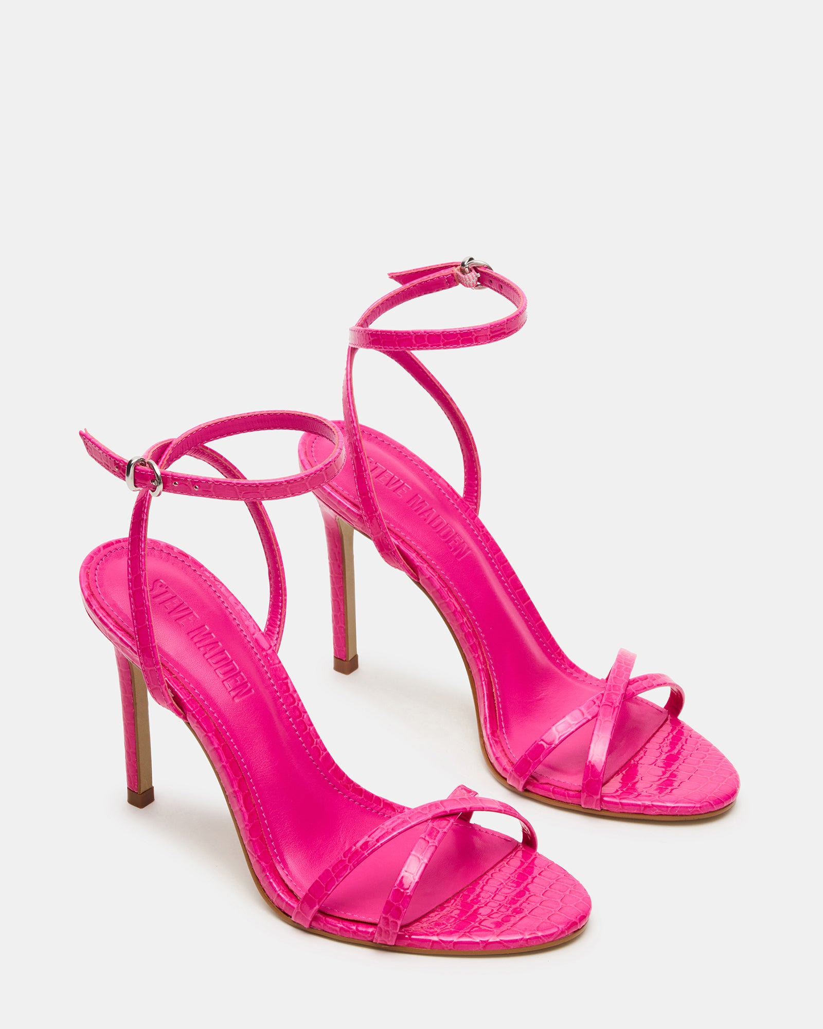 Front view of stylish JYPSEY heels with rounded toe and textured synthetic material
