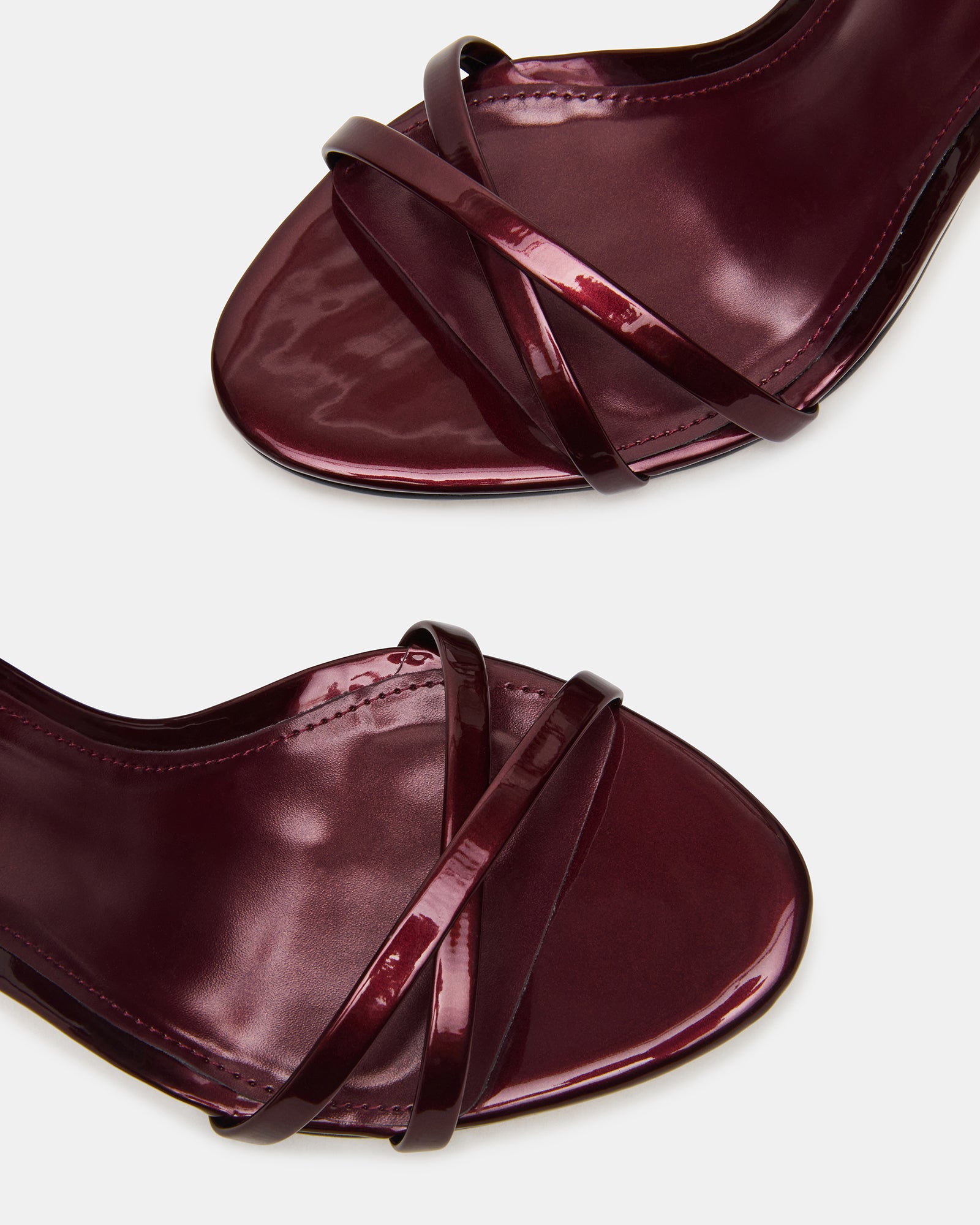 Close-up of crisscross back design on black heels