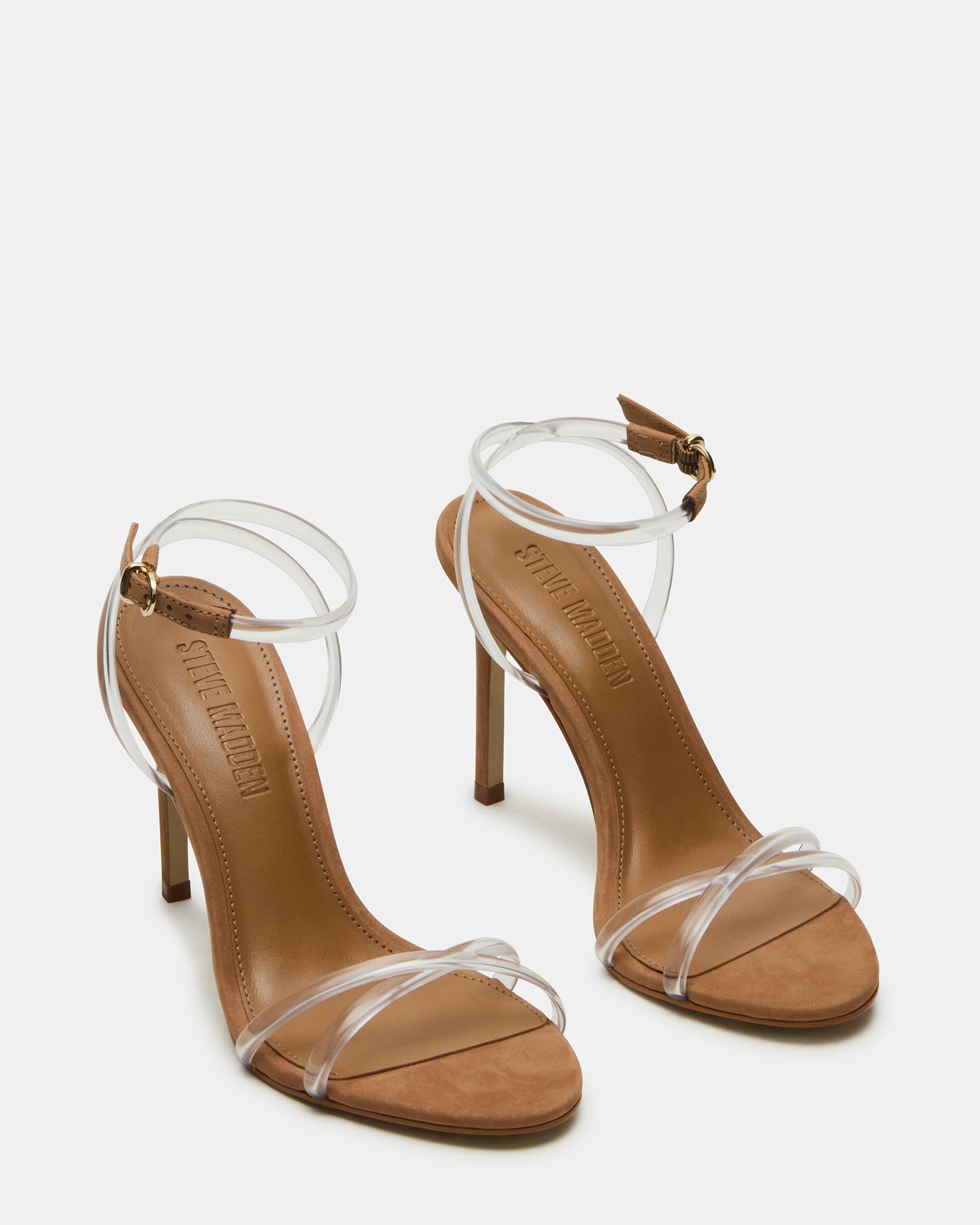 Close-up of crisscross ankle strap and stiletto heel design