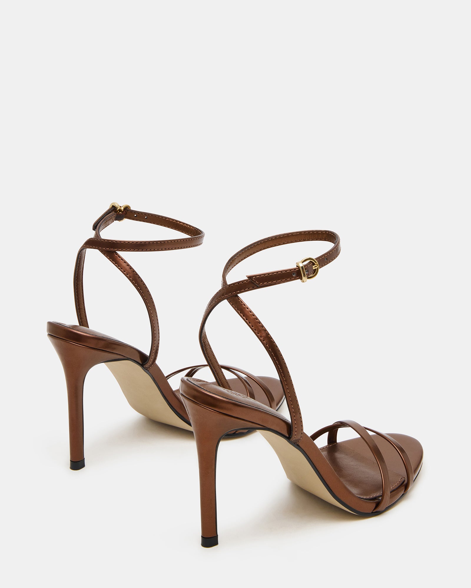 Close-up of black heels with crisscross back detailing