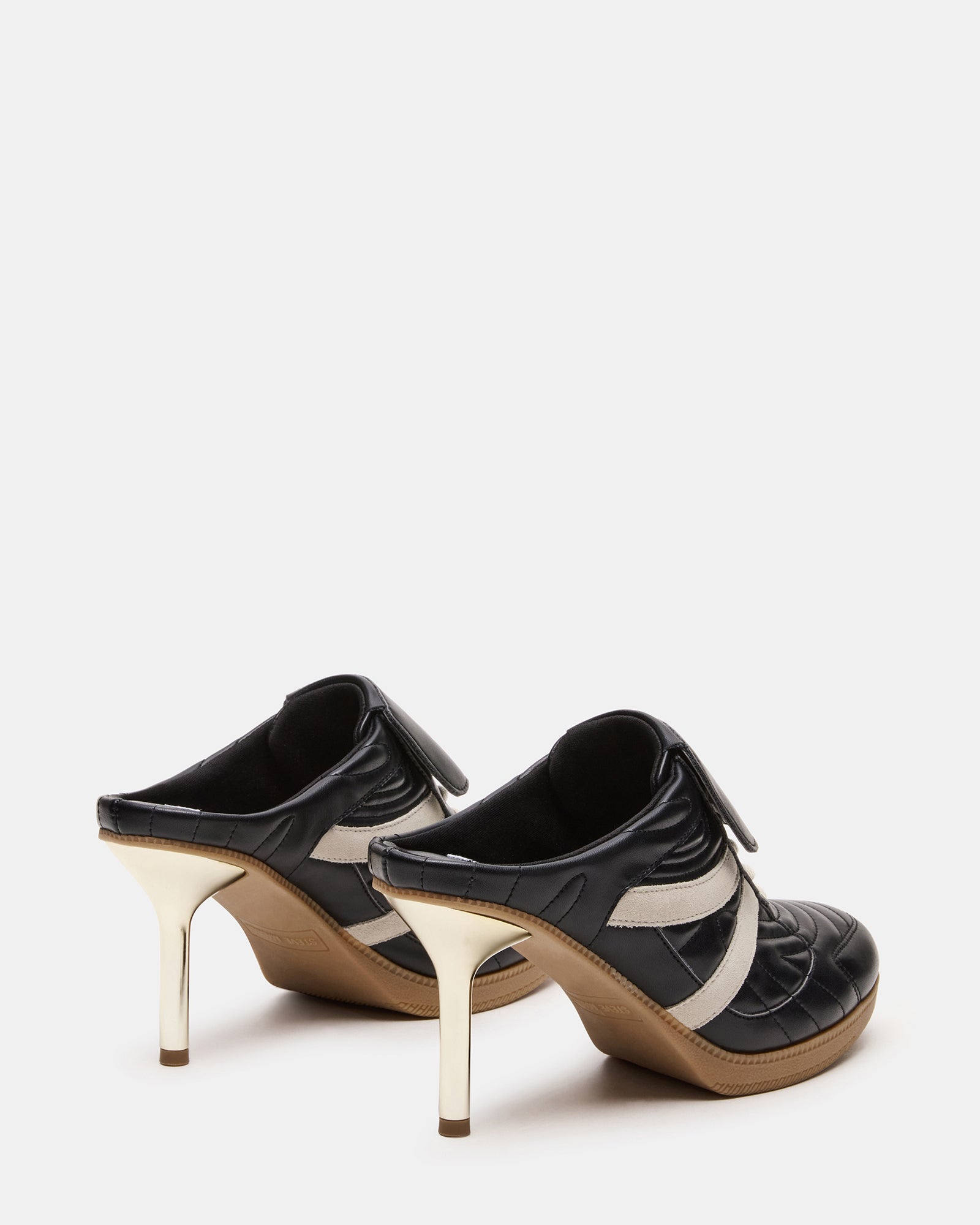 Close-up of KADIN Luxe Mule Sneakers, highlighting the lace-up feature and round toe.