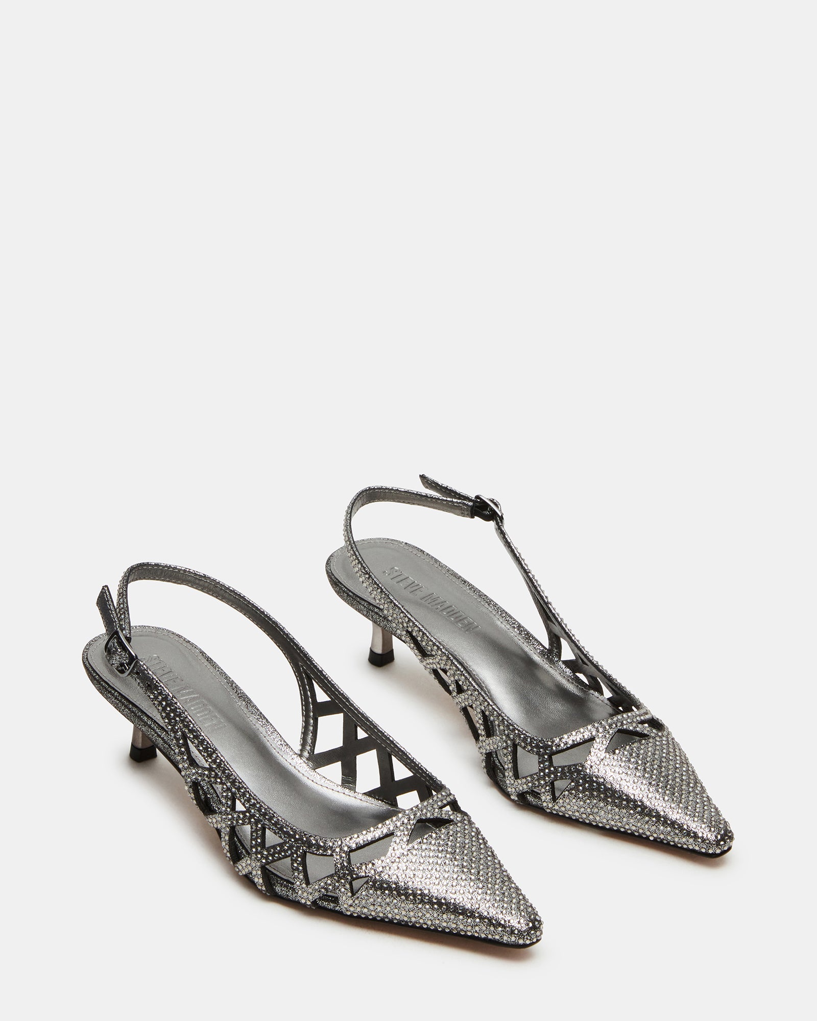 Close-up of pointed toe and embellished upper on gold kitten heels.