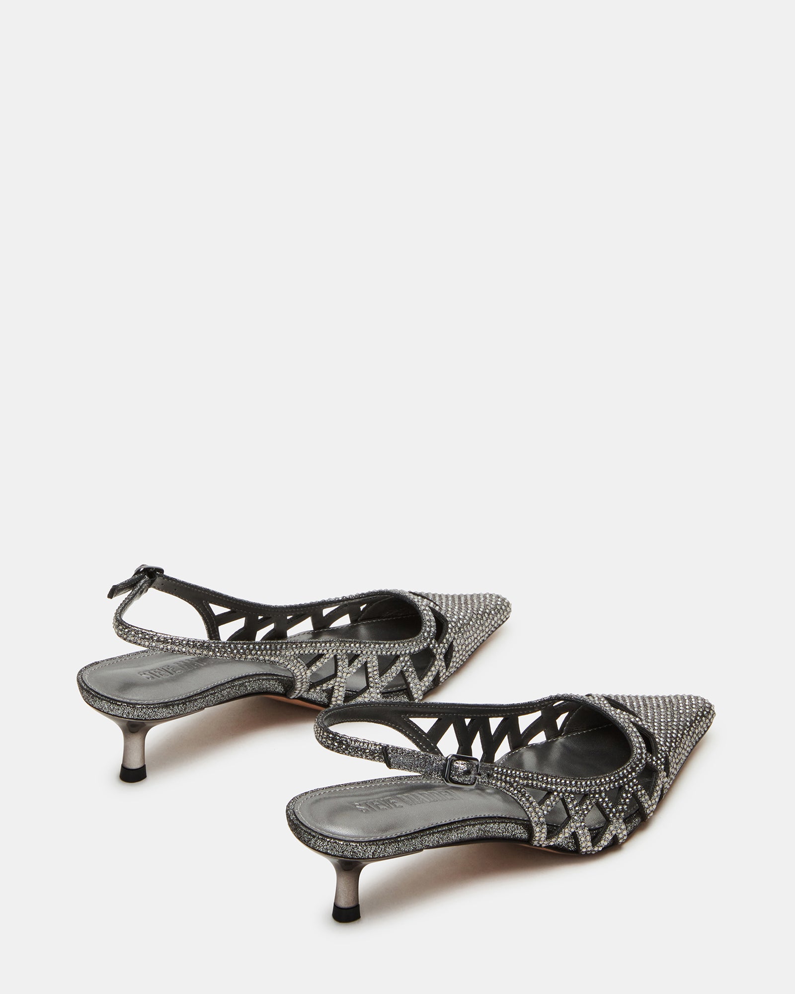 Close-up of pointed toe and embellished upper on gold kitten heels.