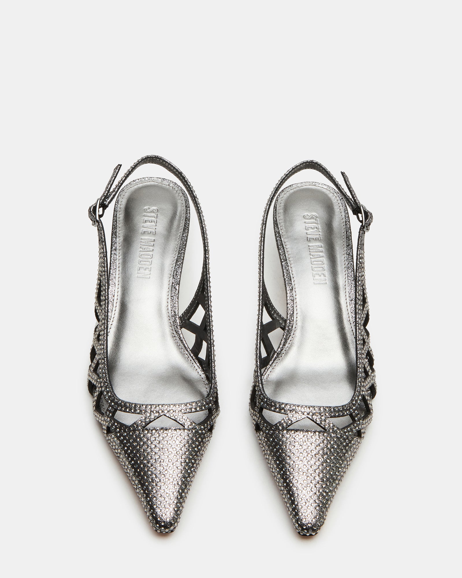 Side view of Kalico pewter kitten heel pumps on hardwood floor, showcasing slingback strap.