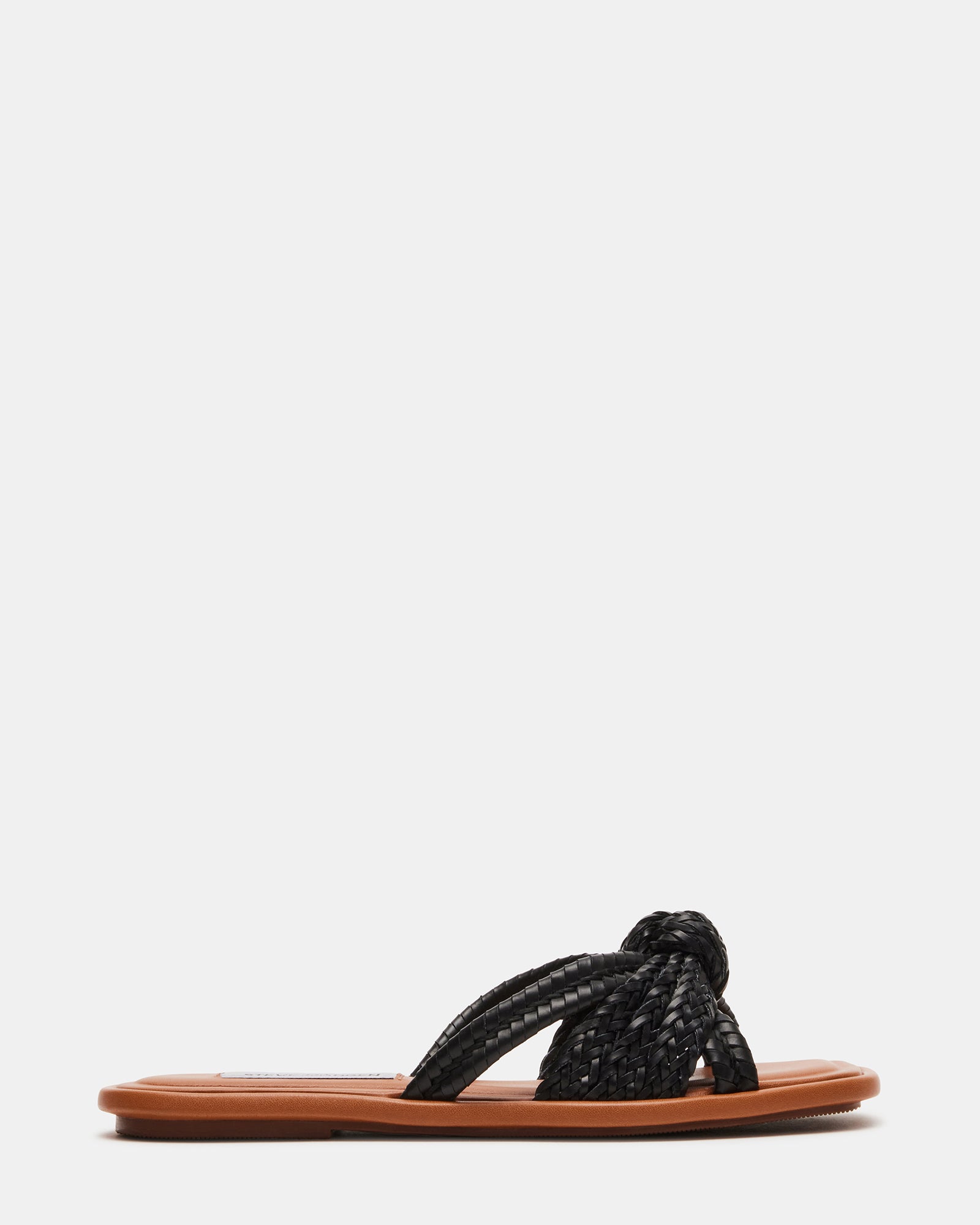 Side view of black ballet flats showing minimalist heel height