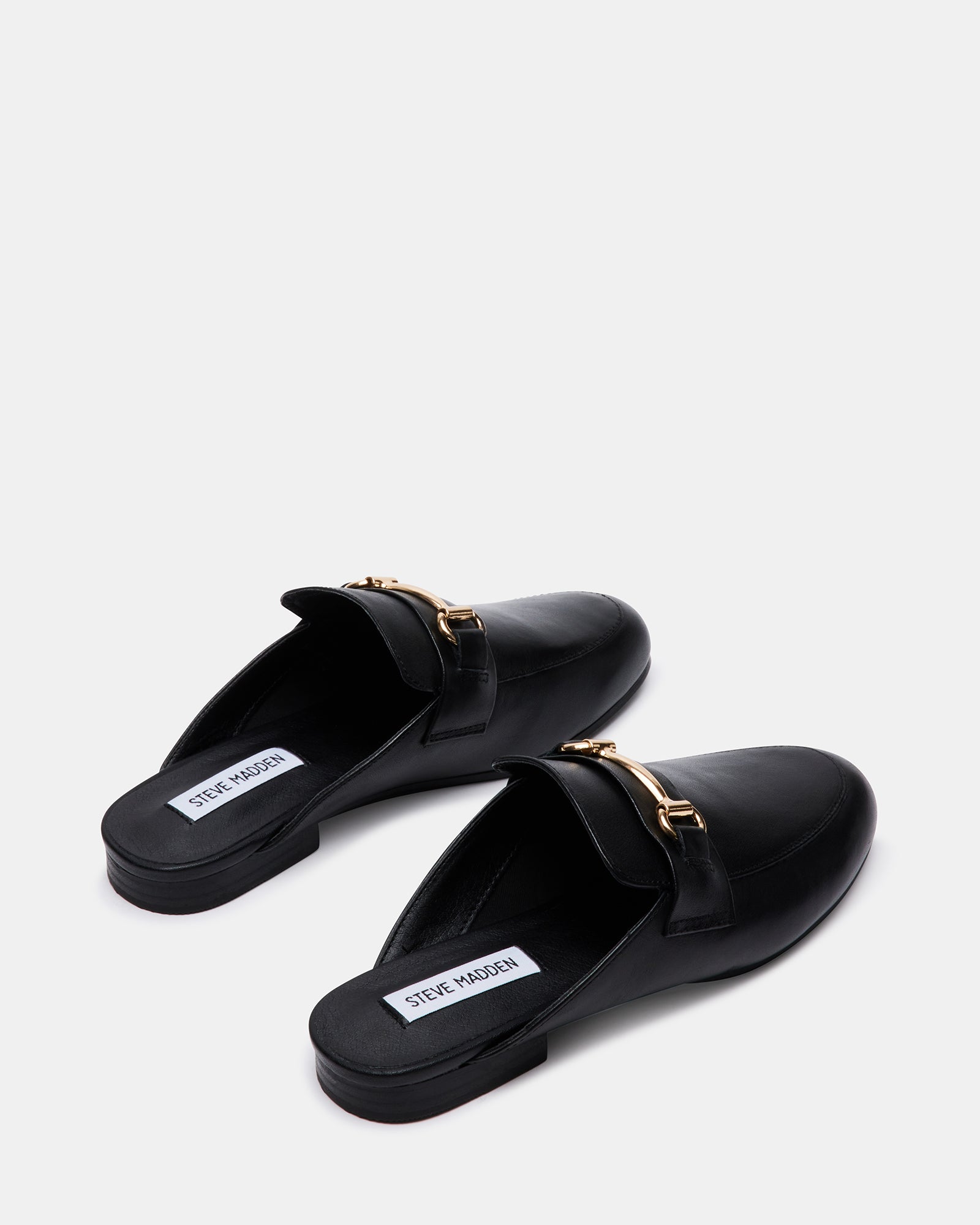 Close-up of the horse bit ornament on Kandi Luxe loafers.