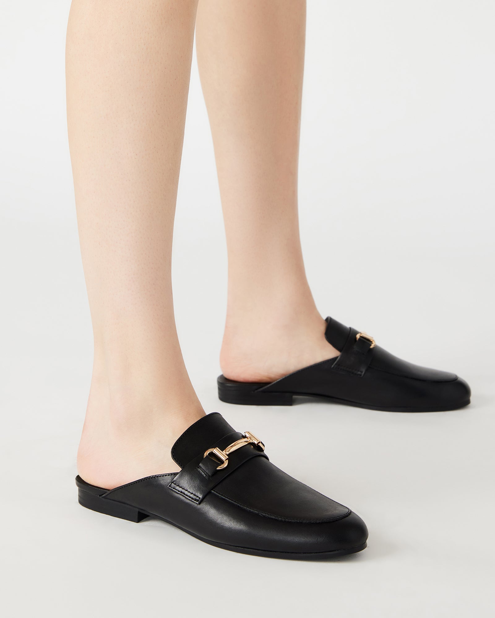 Kandi Luxe loafers styled with a cashmere sweater and skinny trousers.
