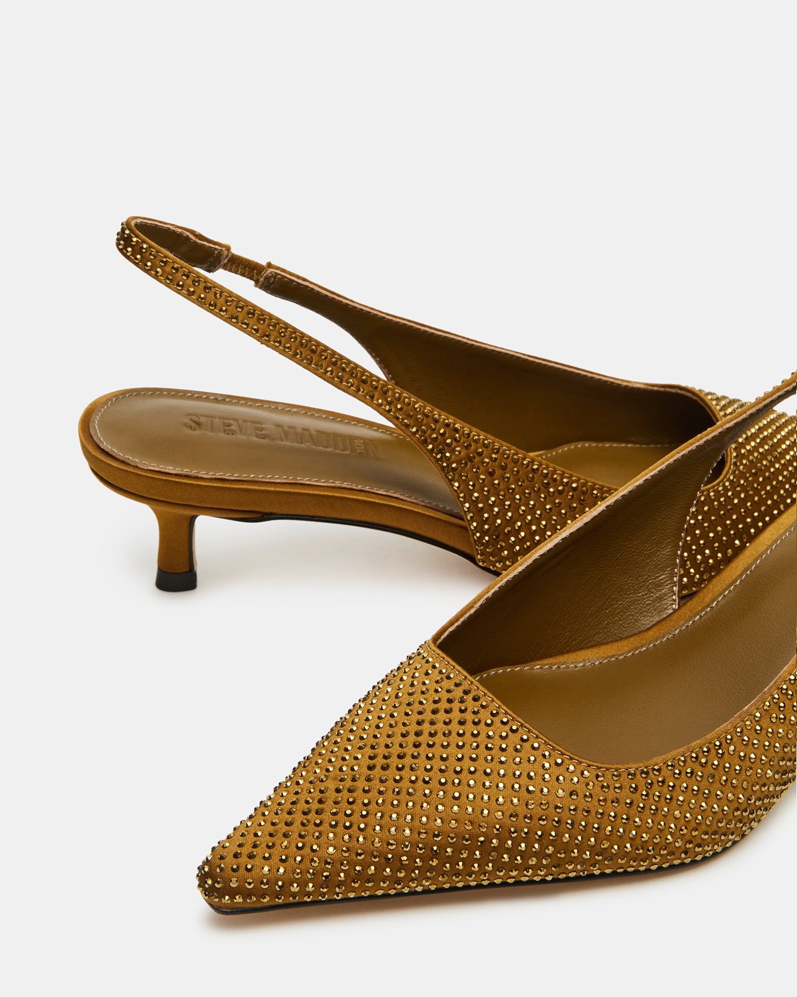 Close-up of the shimmering rhinestones on the heel of the Kari slingback pumps.