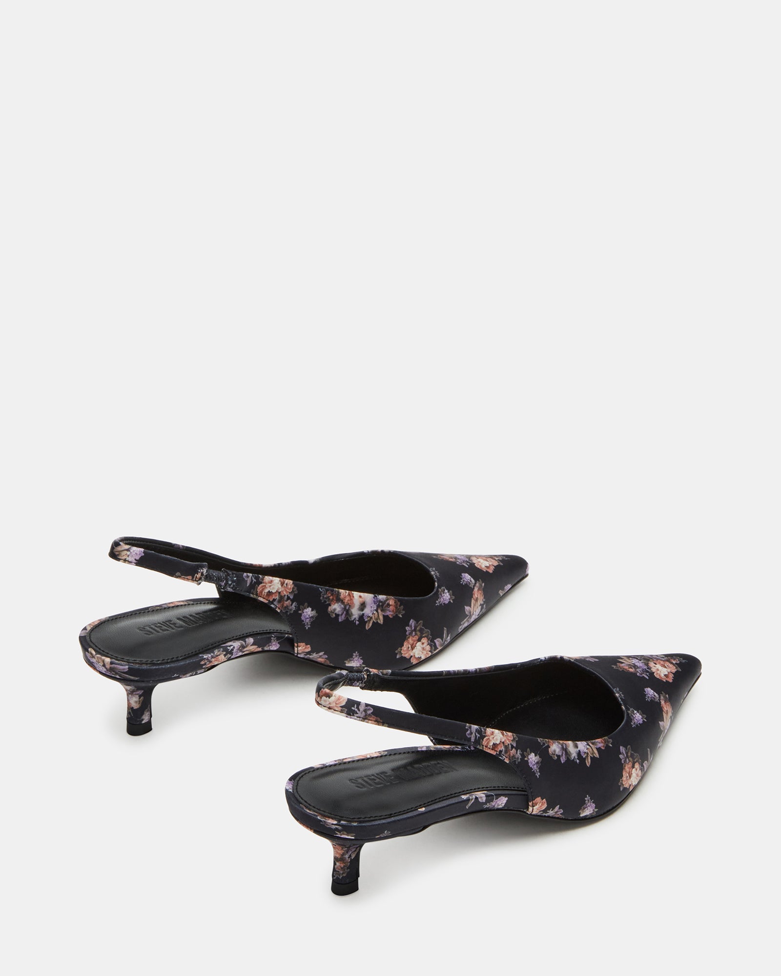 Kari kitten heel boots worn at a casual outdoor gathering, highlighting their stylish design.