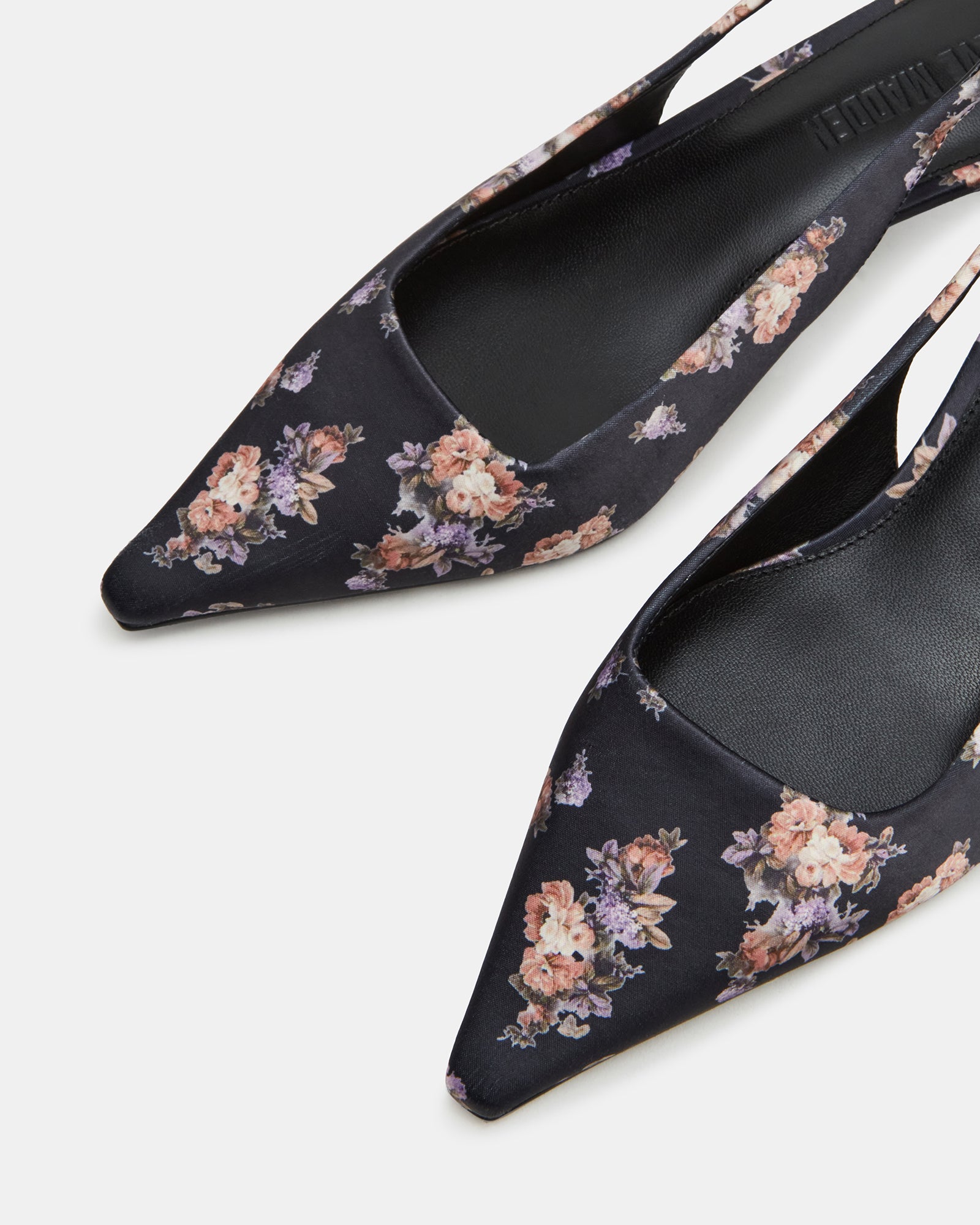 Close-up of the textile upper and leather lining of Kari kitten heel pumps.