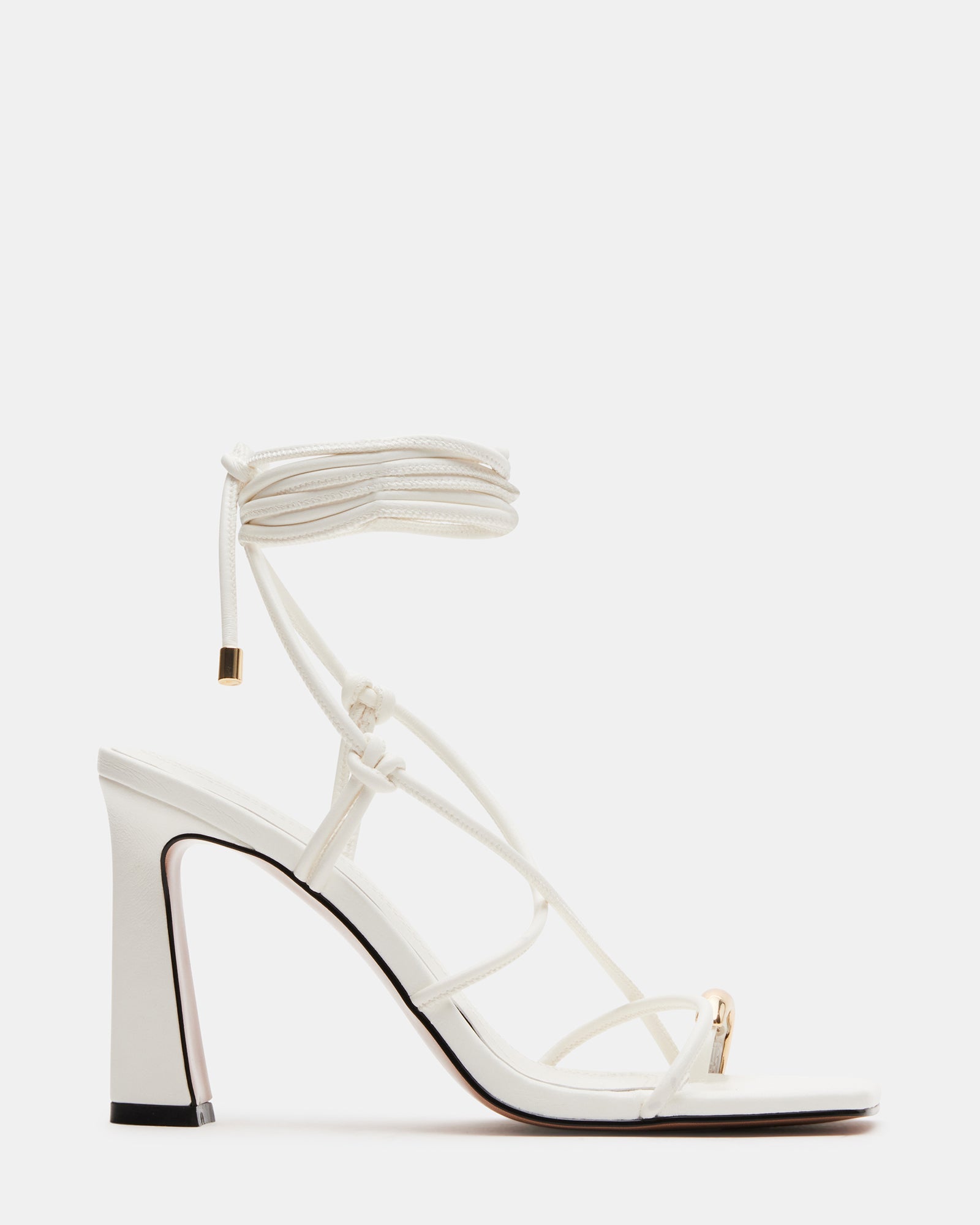 White strappy heels side view showcasing lace-up detail