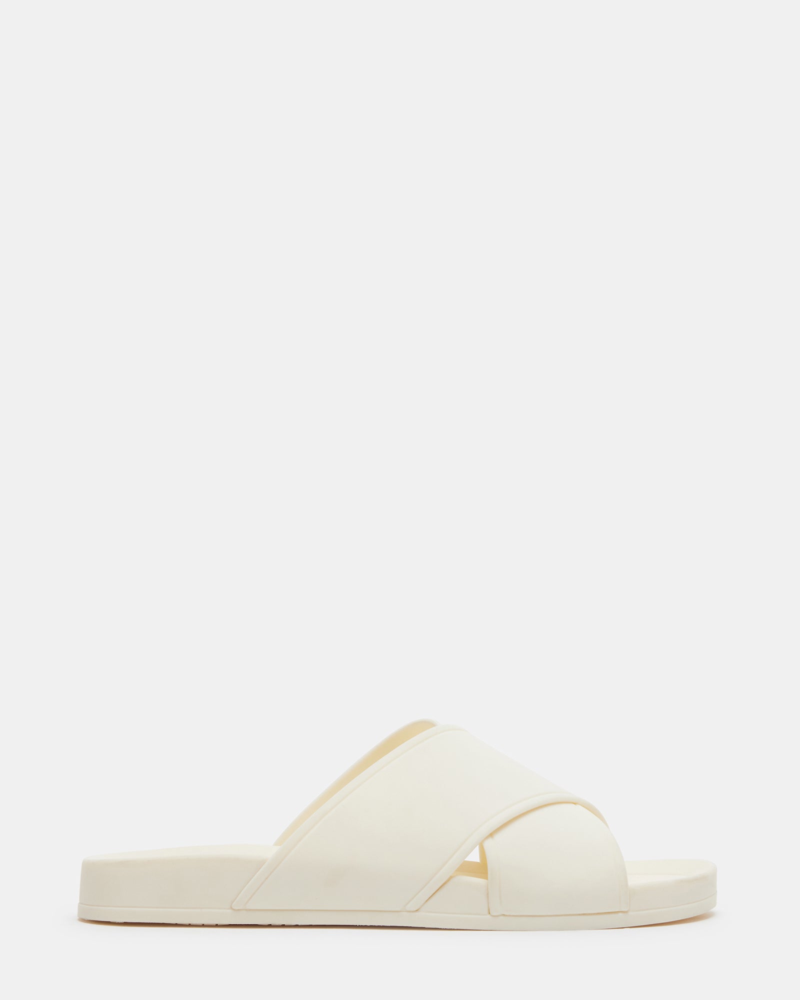 Katelyn Bone slide sandals modeled on a sidewalk in Miami