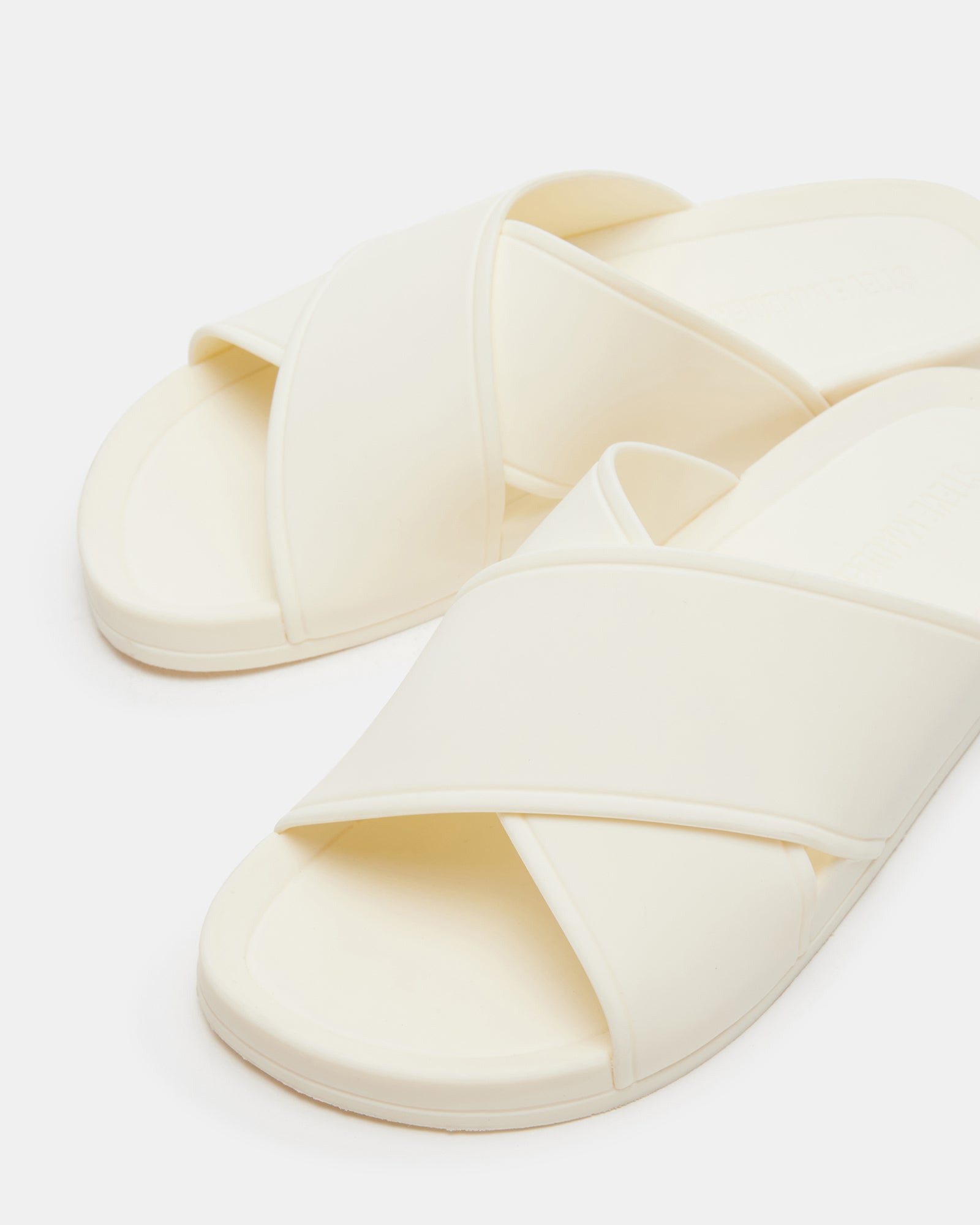 Katelyn Bone slide sandals modeled on a sidewalk in Miami