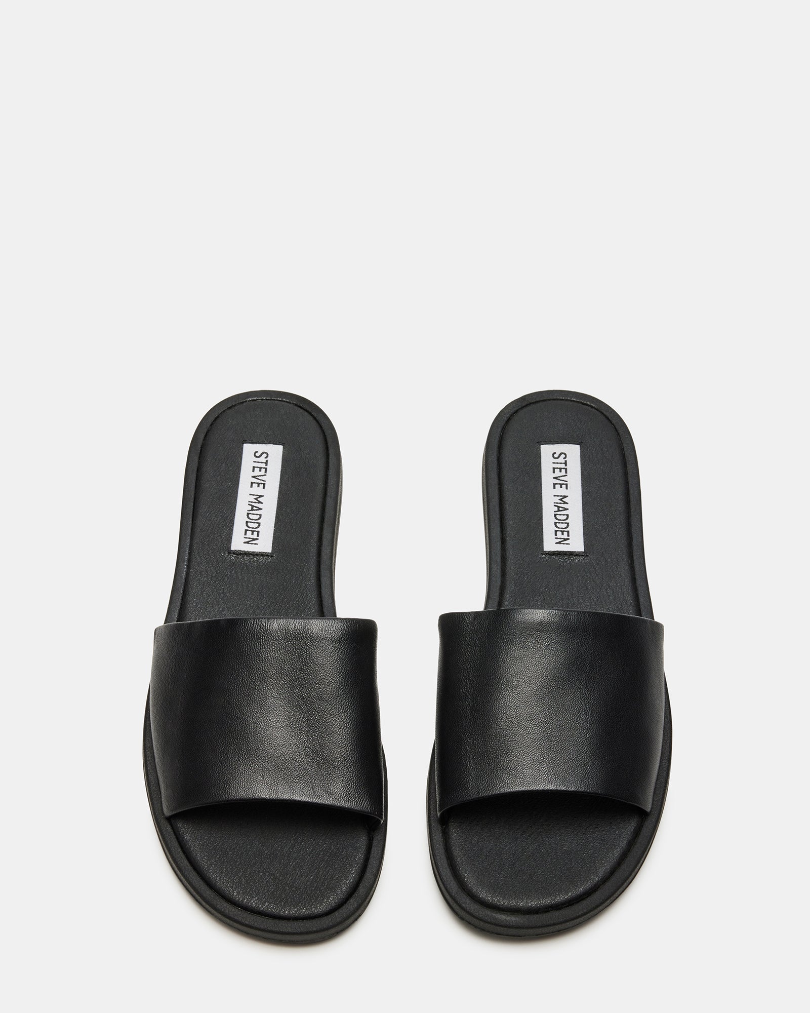 Stylish Kaya black leather slide sandals displayed on a white background.