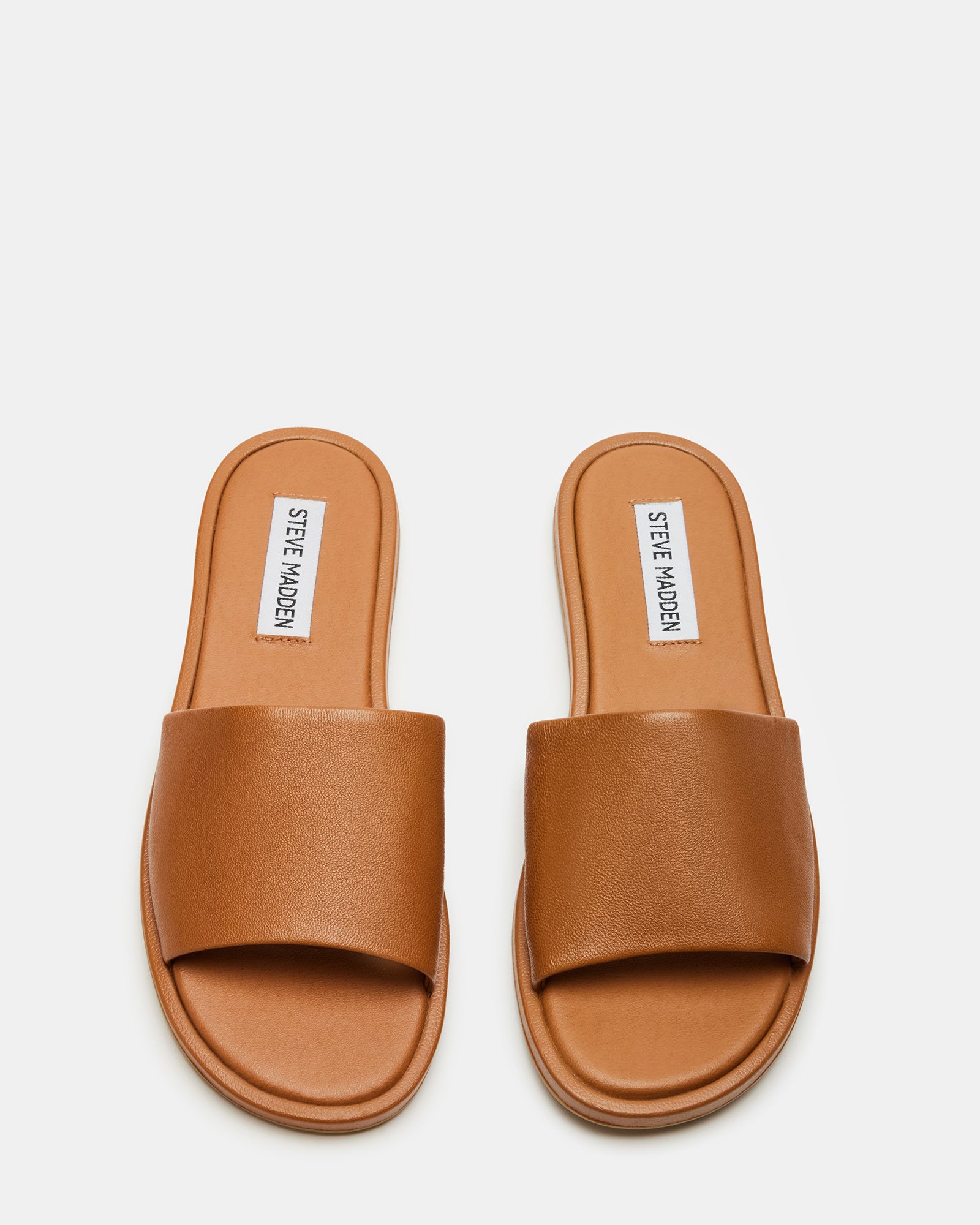 Brown leather slide sandals with wide straps, perfect for casual wear.