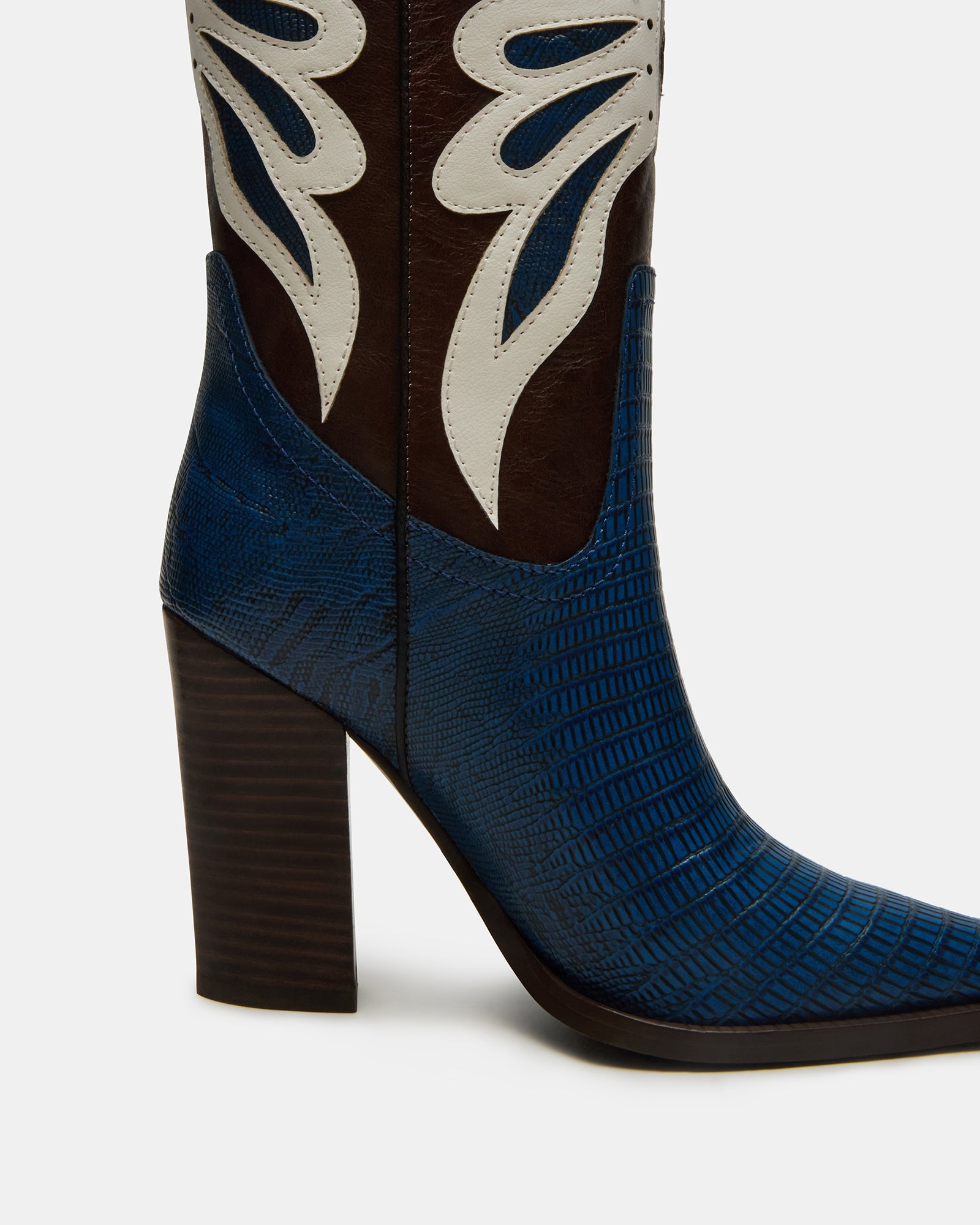Stylish outfit pairing featuring KAZ pointed-toe boots with denim for a modern Western look.