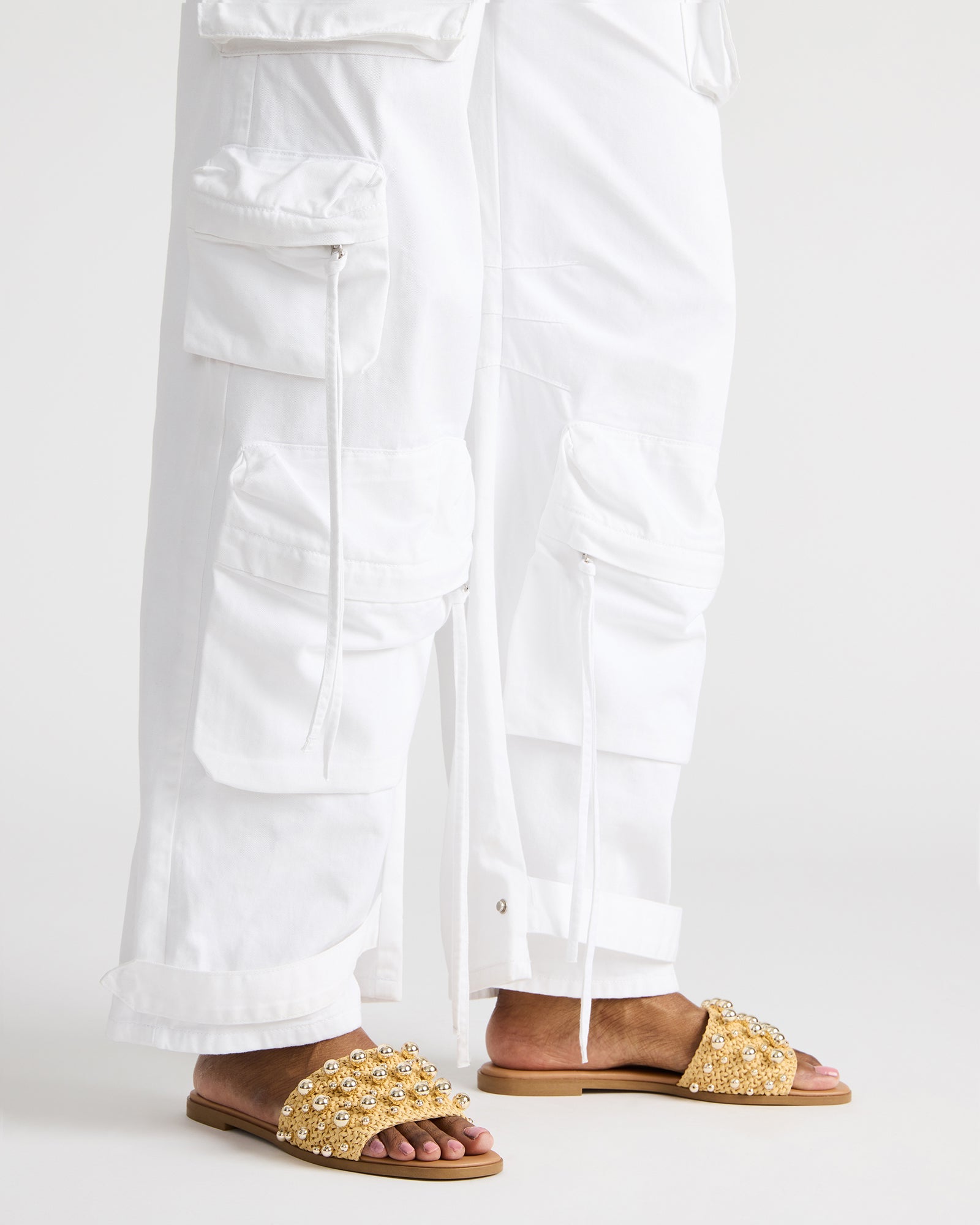 Side view of black studded sandals perfect for summer events.