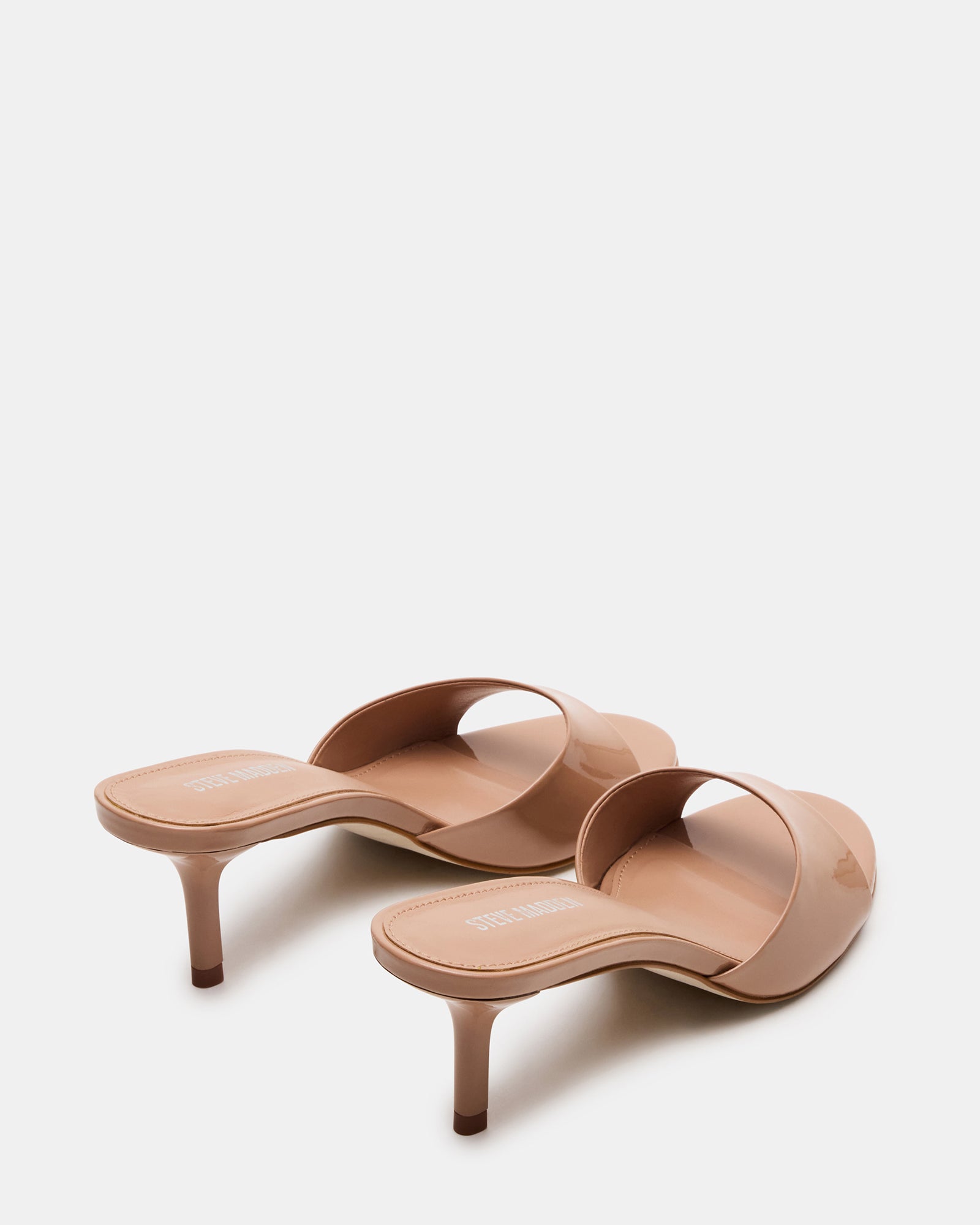 Side view of the KENDRIX blush leather kitten heel mules highlighting the sleek design.