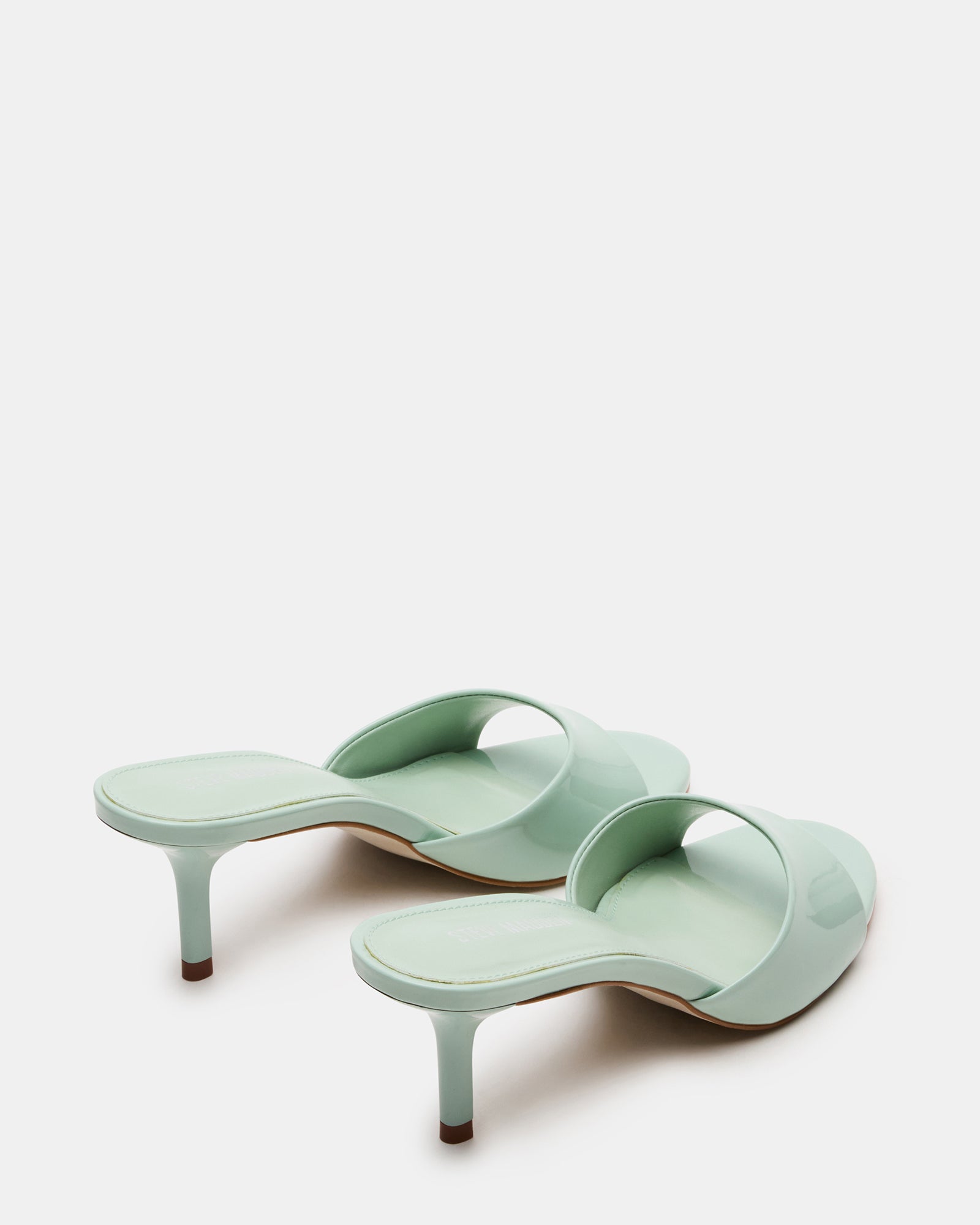 Front shot of KENDRIX mules showing rounded toe and 3-inch heel, suitable for black or white heels styles