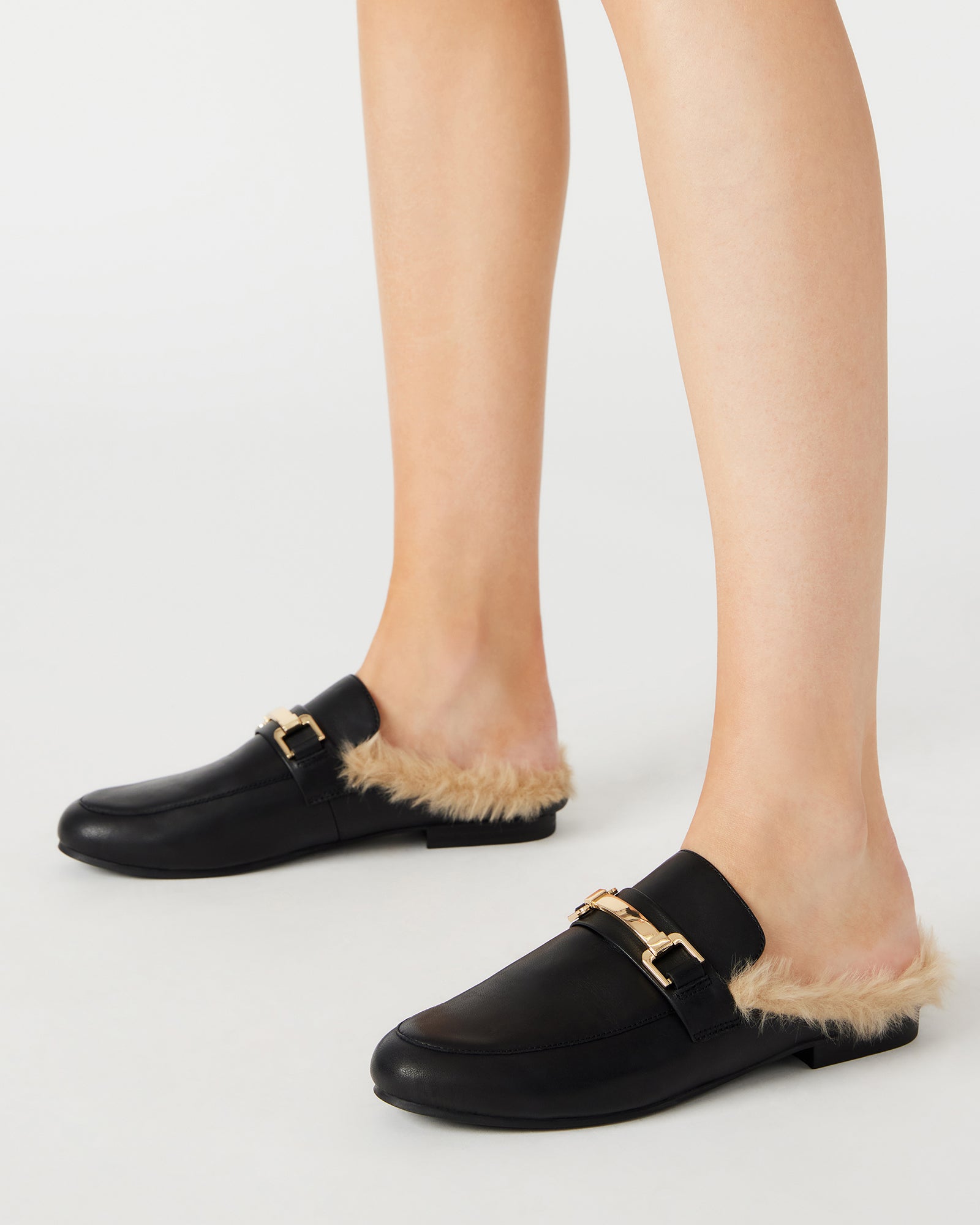 Close-up of the metallic detail on KHLOE black leather mules