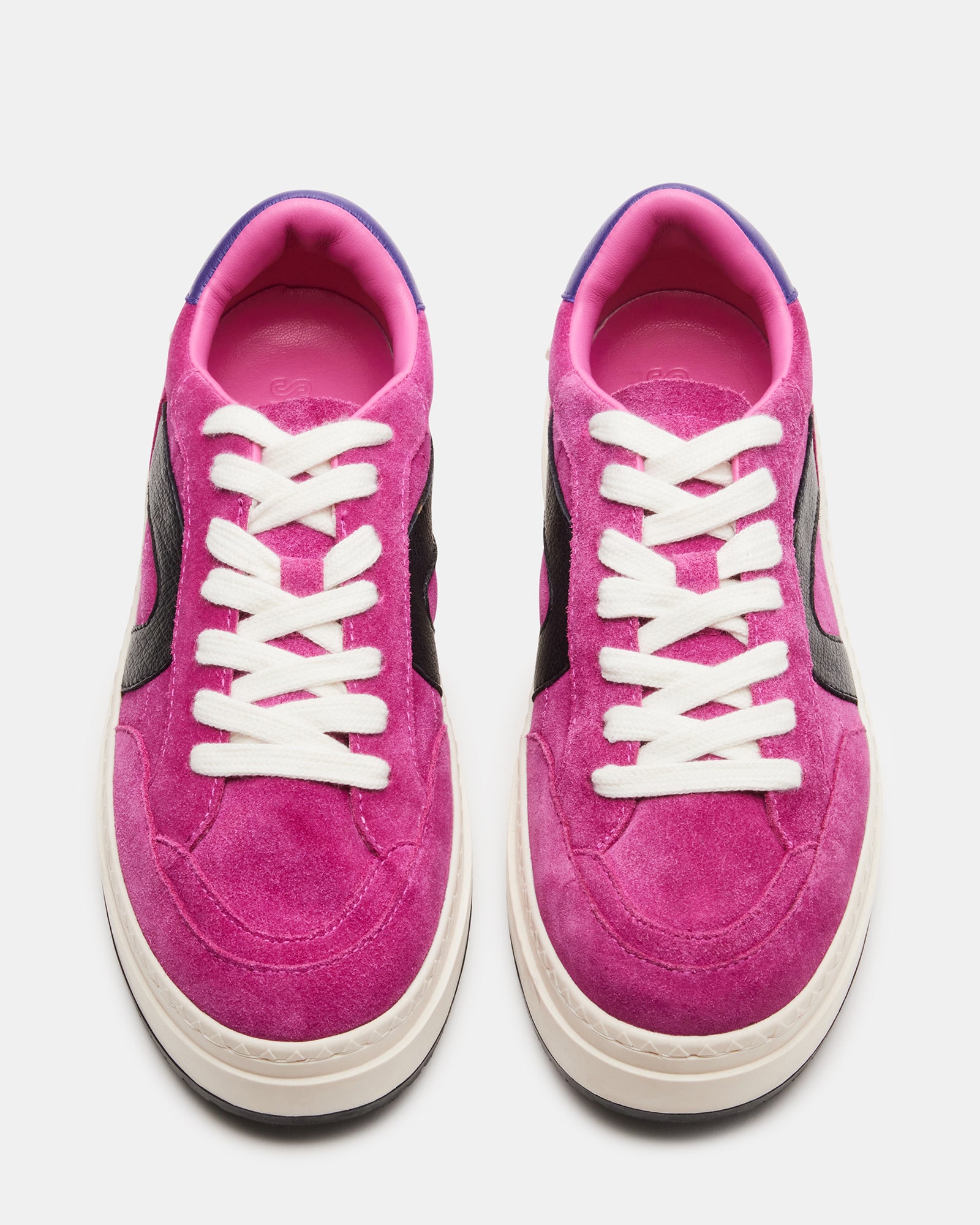 Womens pink suede platform sneakers from a side angle