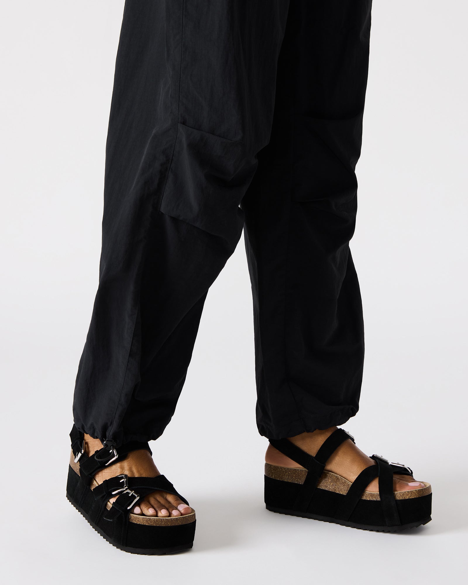 Pink suede womens sandals paired with a summer outfit