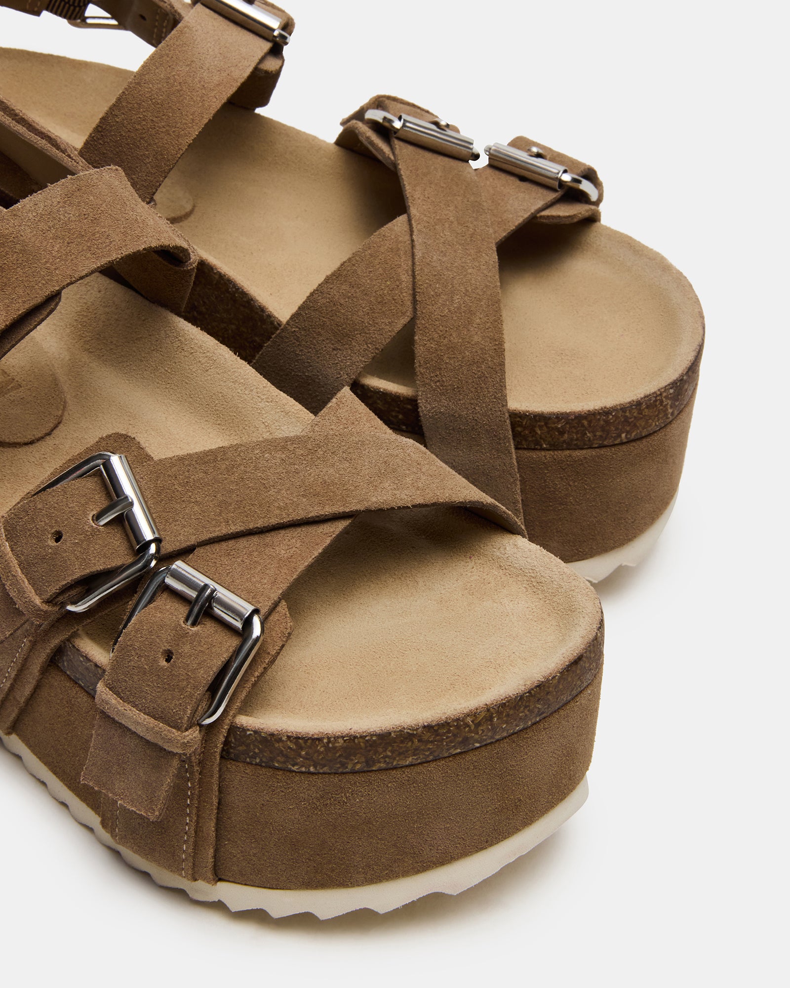 Side view of strappy flatform sandals with suede upper and buckle detail