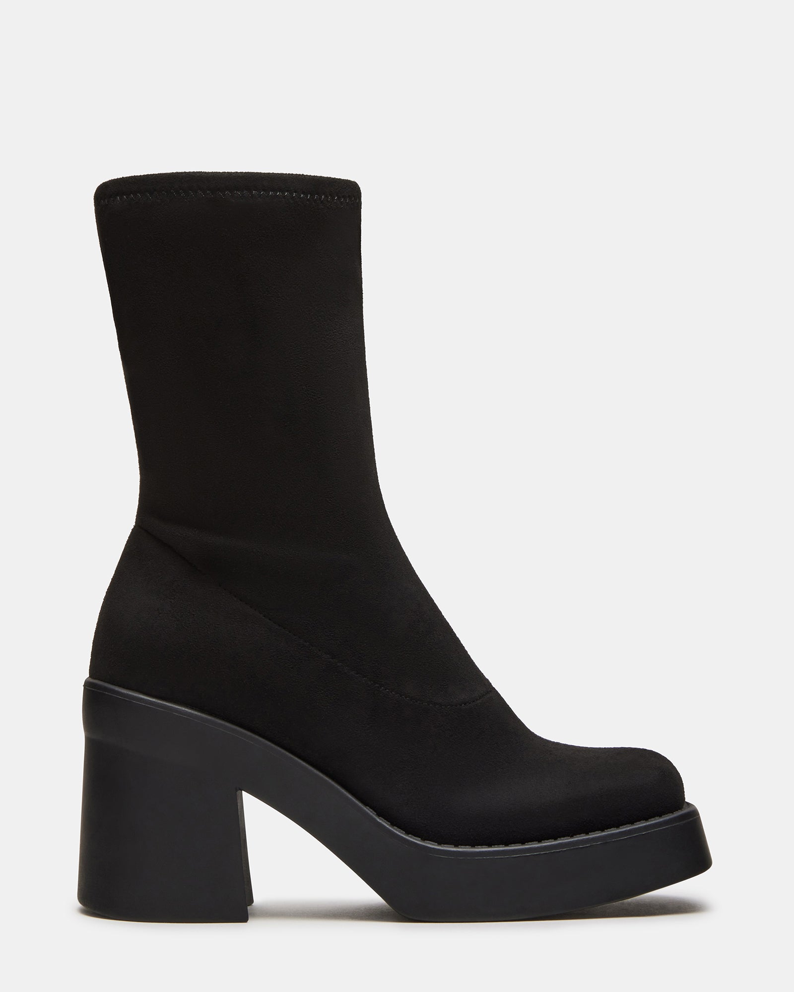 Front view of retro ankle boots styled with midi skirt