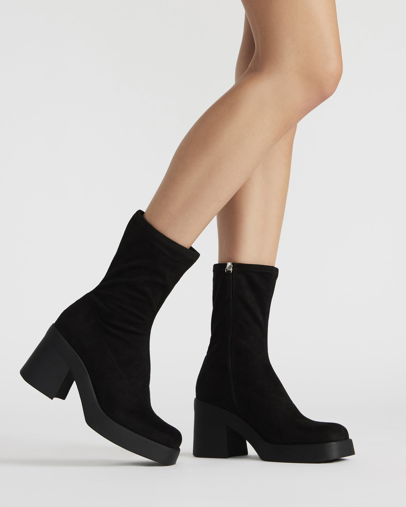 Side angle of boots platform shoes showing thick sole and microsuede texture