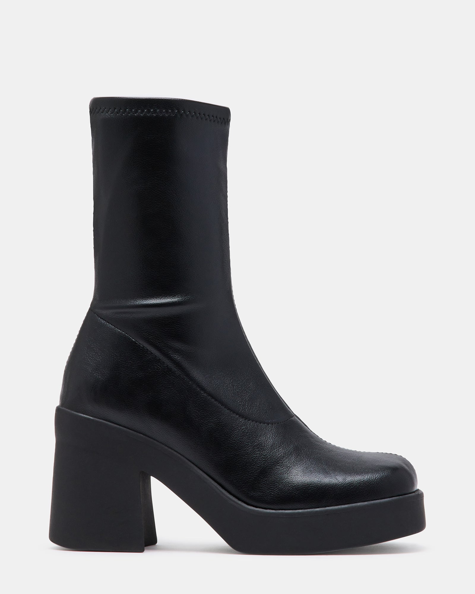 Side view of 70s inspired boots with thick white platform sole