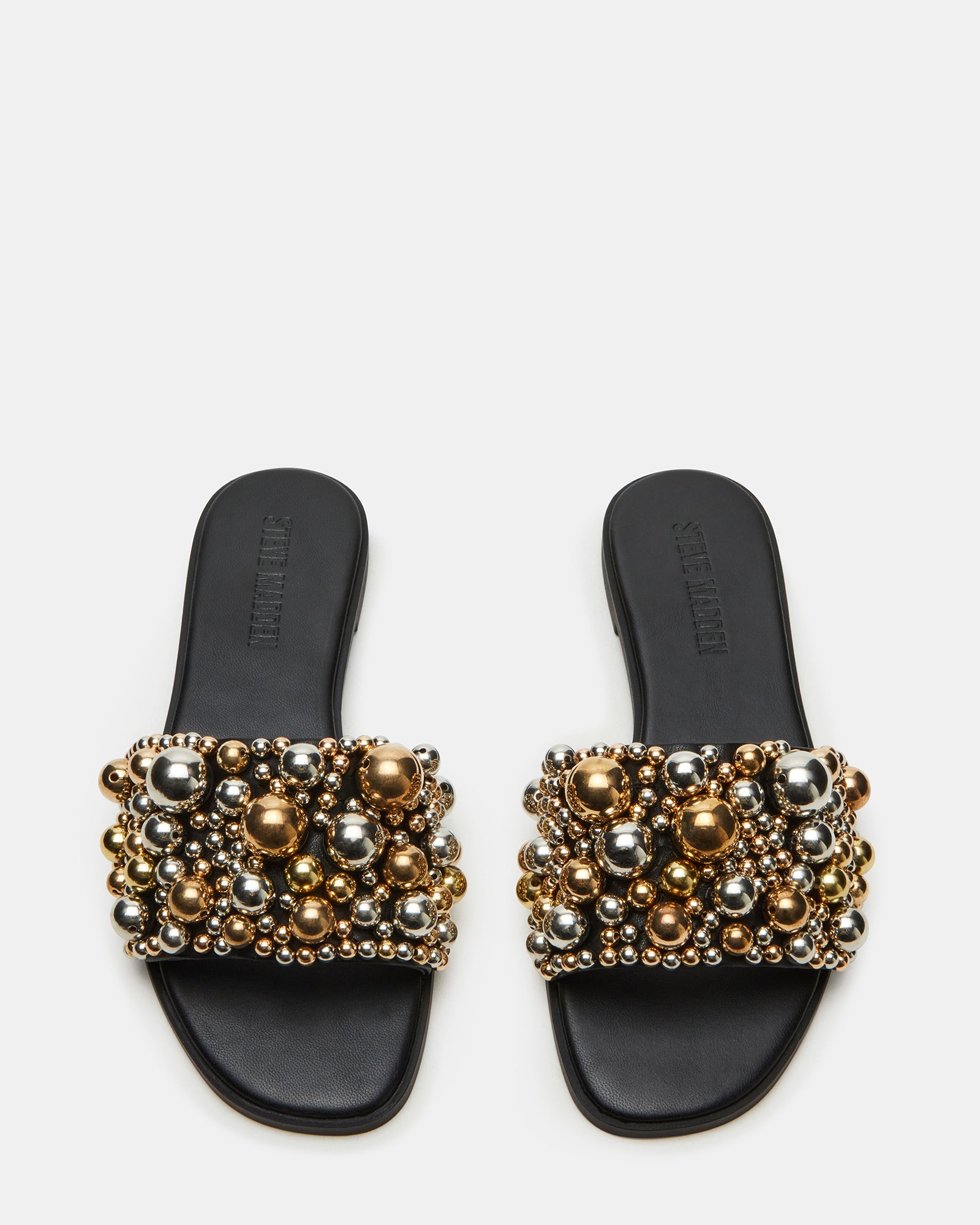 Close-up of the detailed ornaments on KLIO womens slide sandals