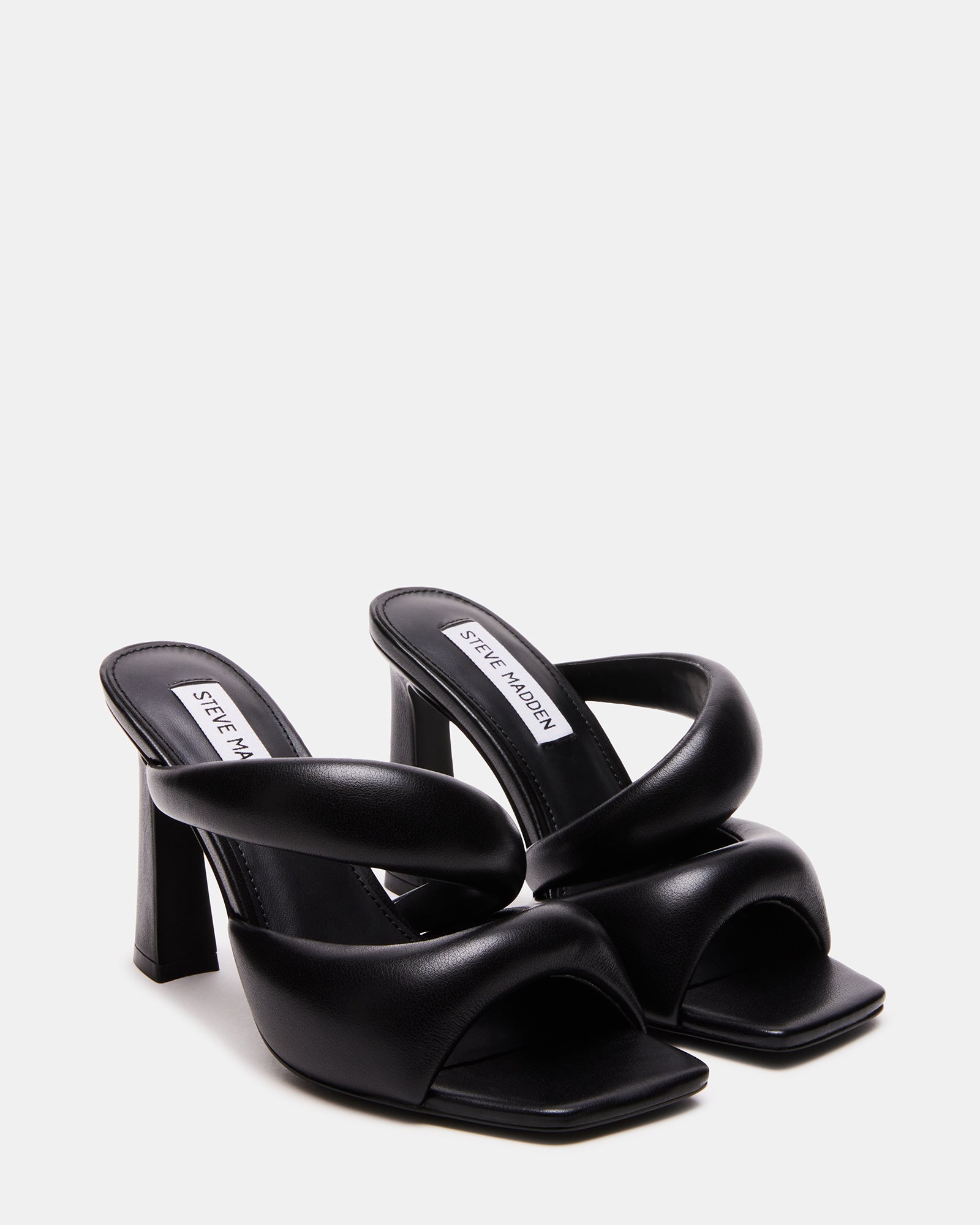 KLOSS Black sandals styled with a casual outfit, perfect for outings.