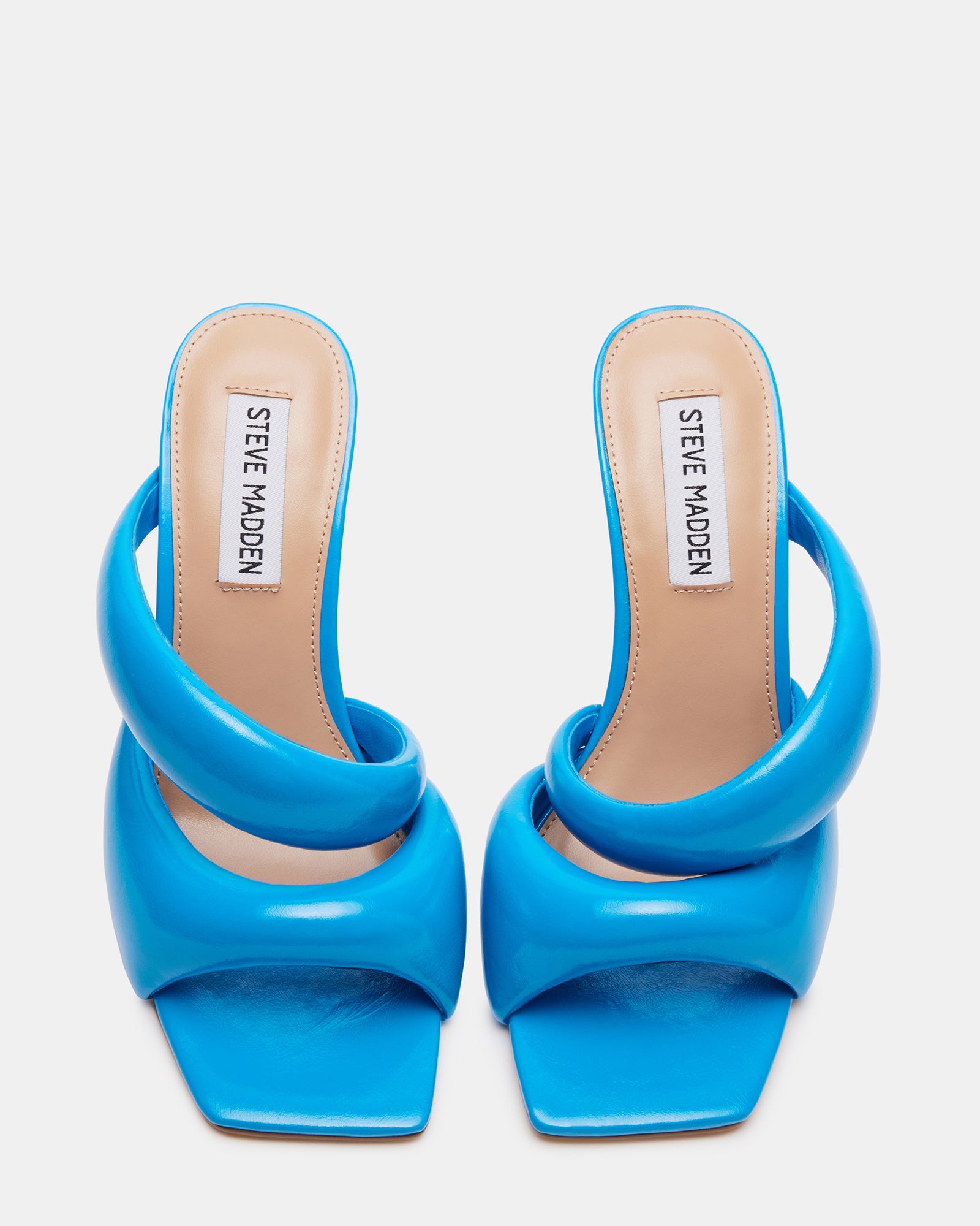 Front view of KLOSS turquoise square toe sandals on wooden background