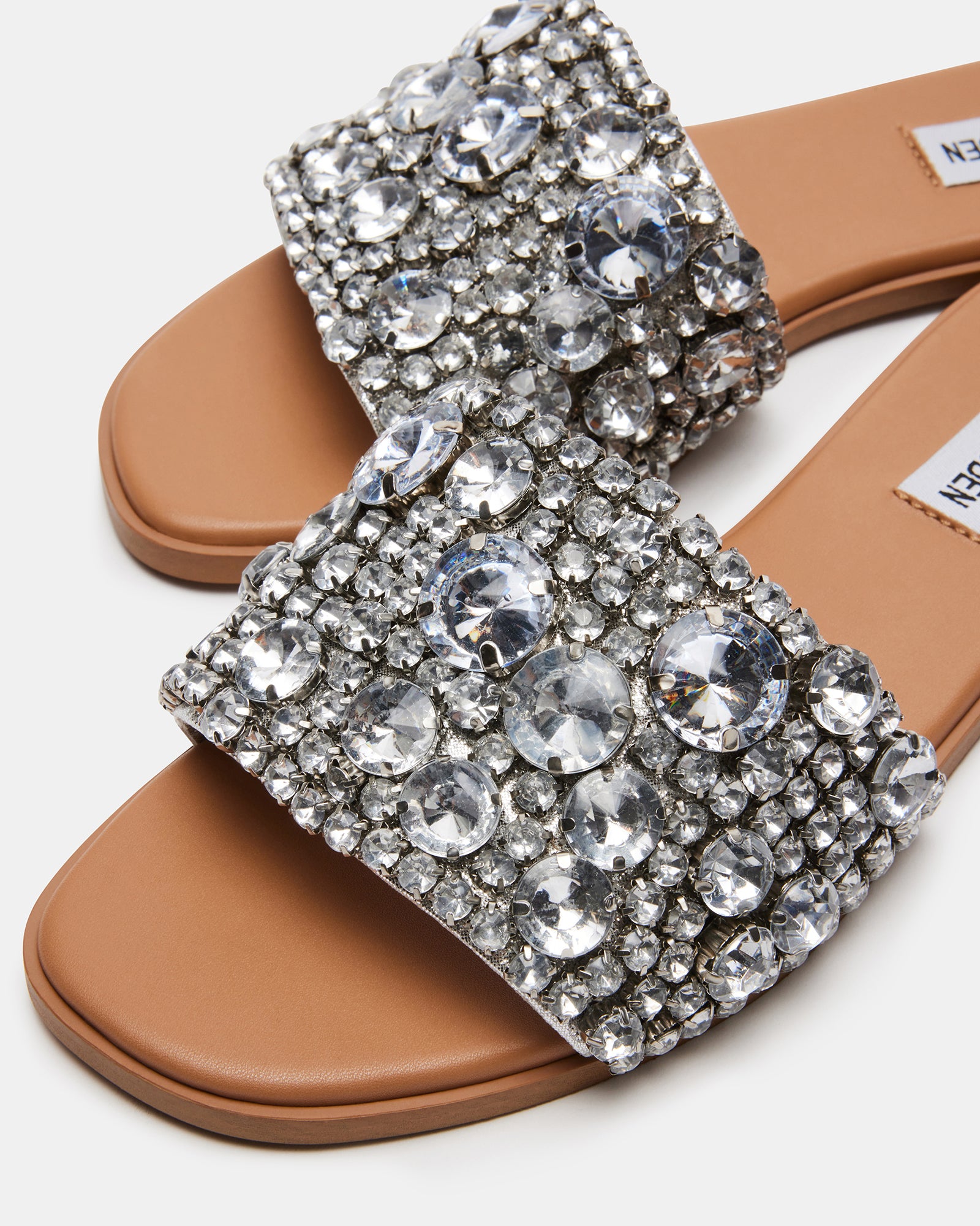 Close-up of black rhinestone sandals showing sparkling details