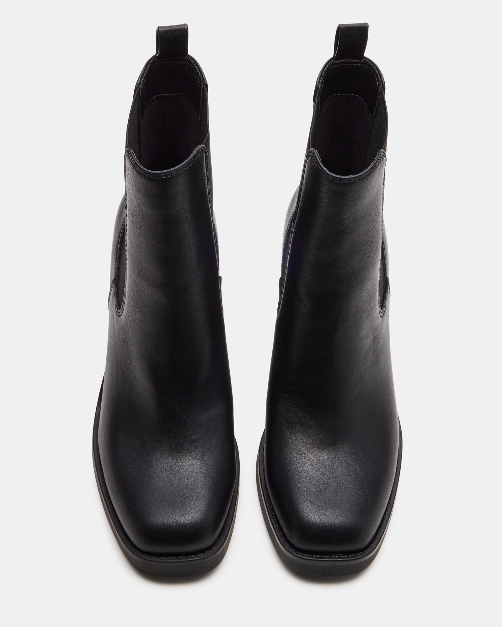 Close-up of block heel boots emphasizing stitching and texture