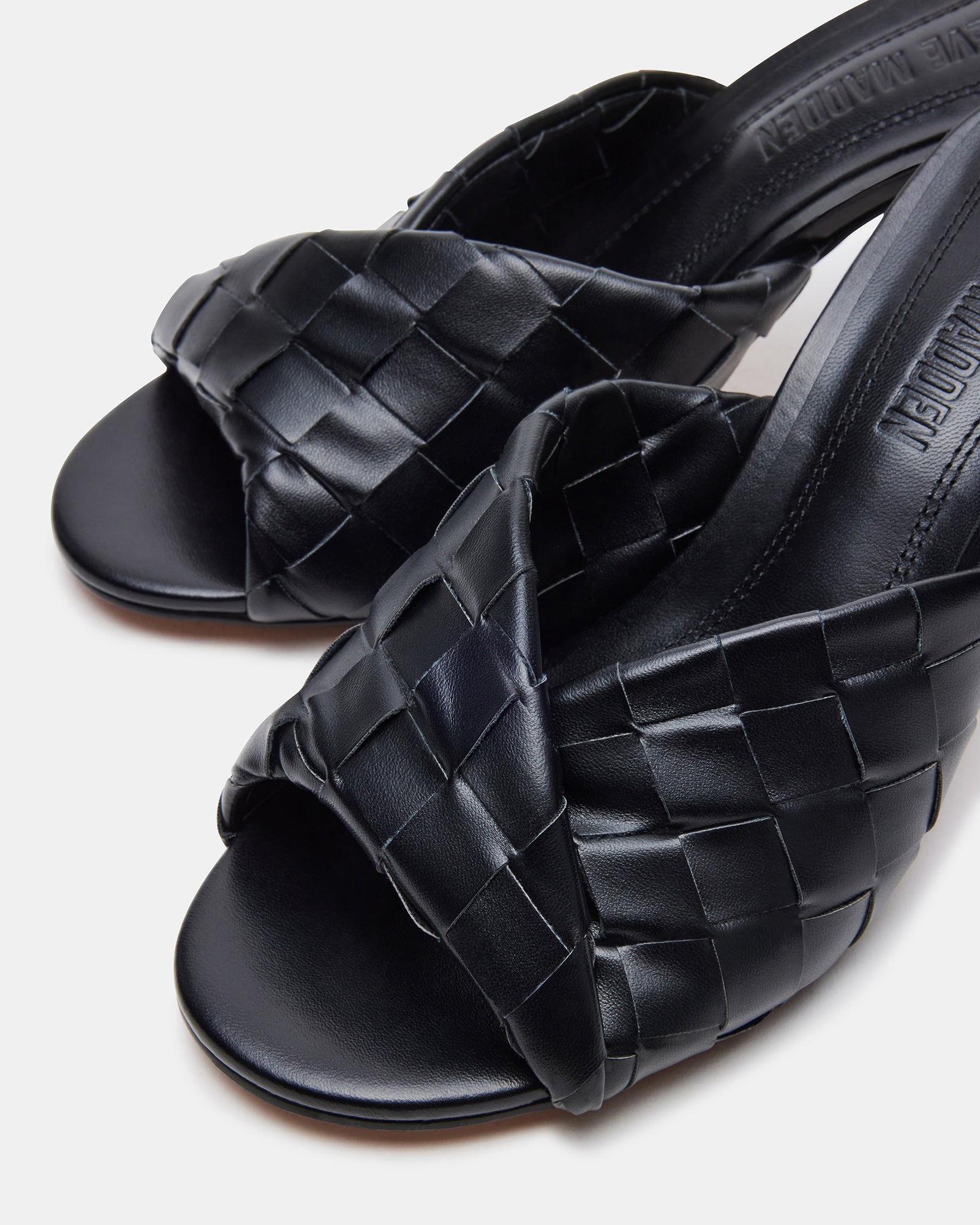 Side view of KOUTURE BLACK stiletto mule with rounded toe and 3.25-inch heel