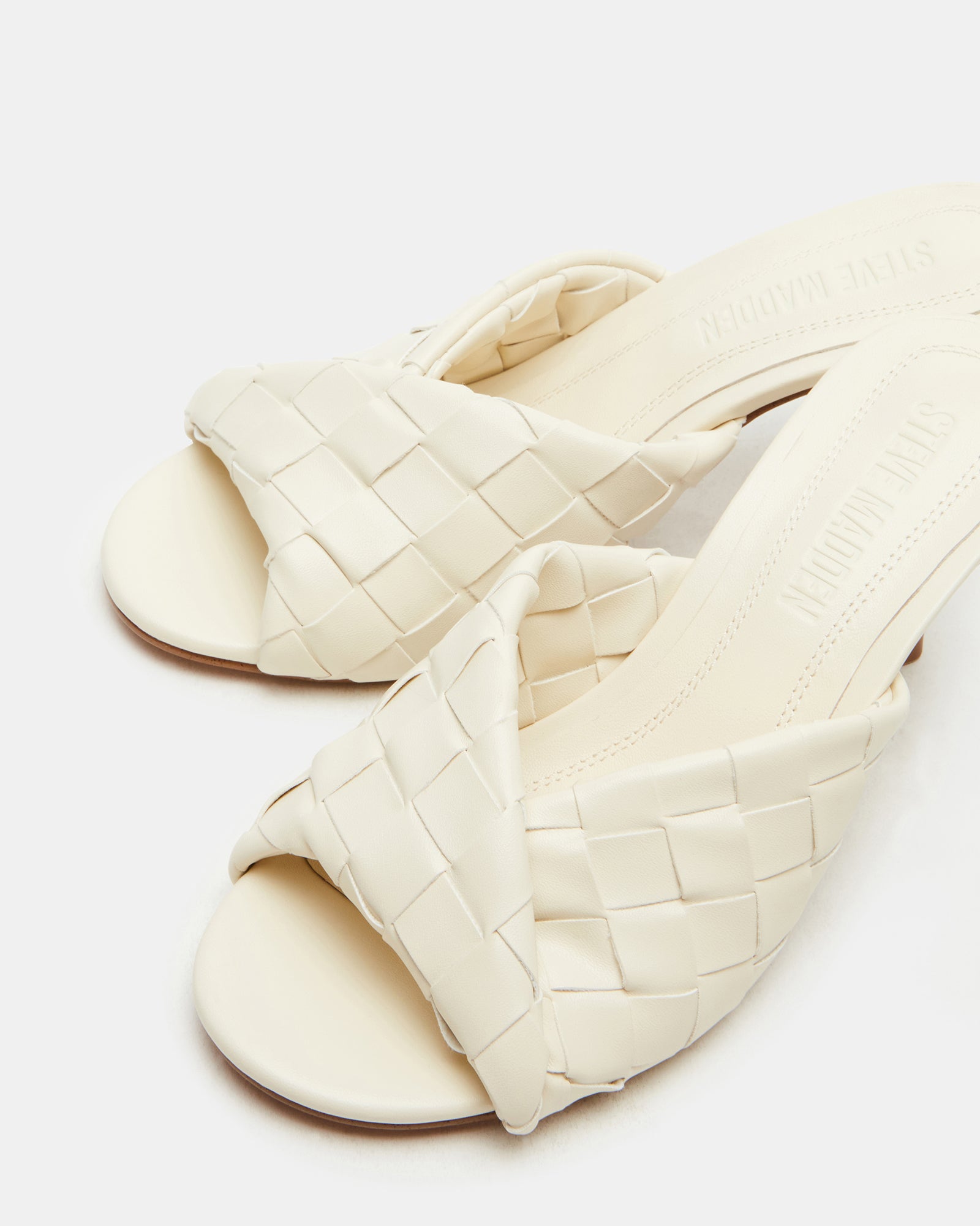 Side view of designer stiletto mules showing 3.25-inch heel height