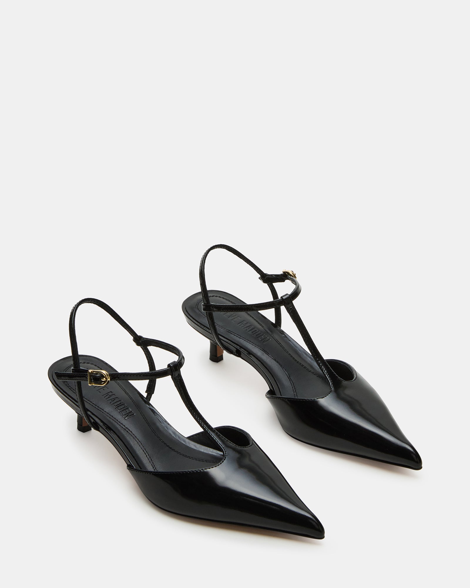 Close-up of the pointed toe and ankle strap on Kyrie black leather heels