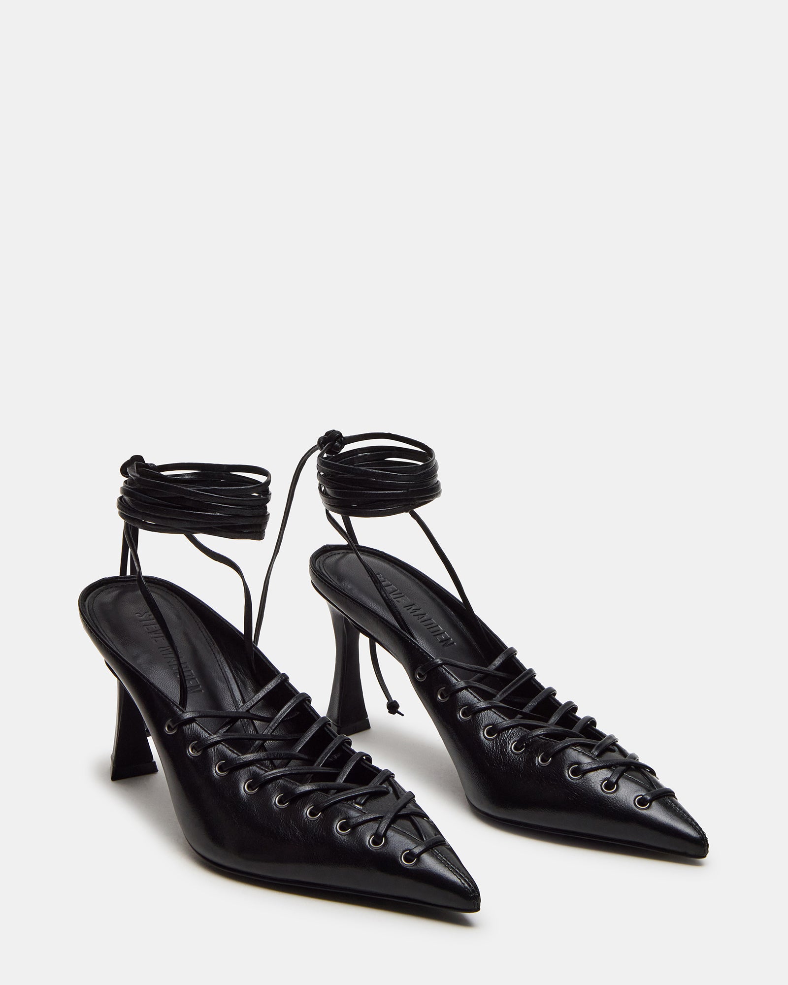 Pointed toe nude strappy heels paired with a cocktail dress.