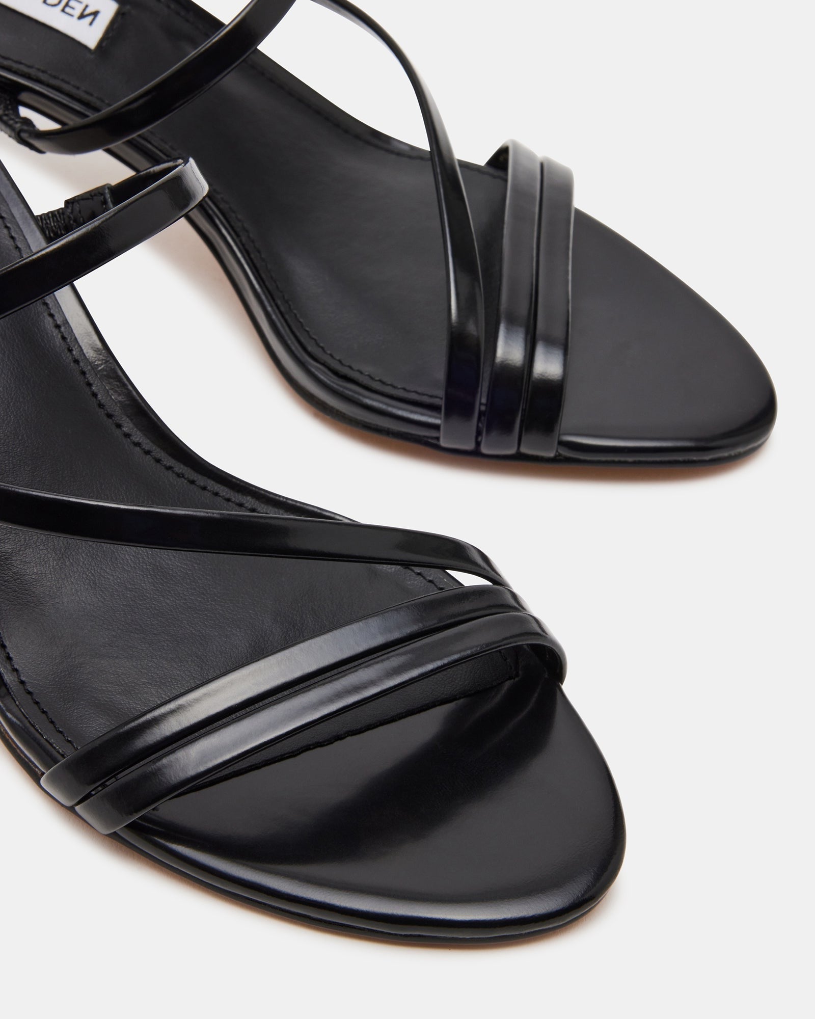 Lamora Black Leather Mules front view, showcasing strappy design