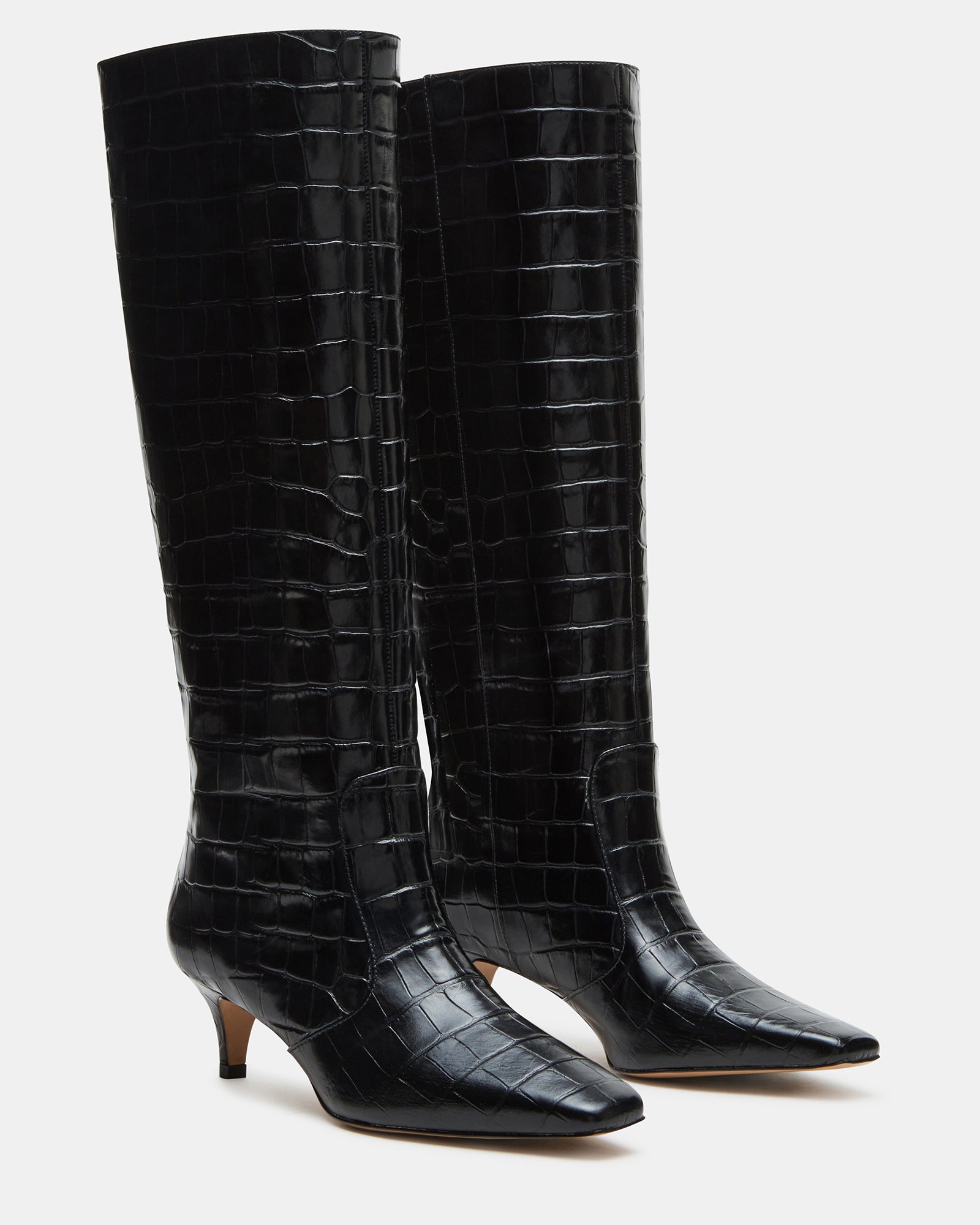 Side view of stylish black knee high cowboy boots suitable for various occasions.