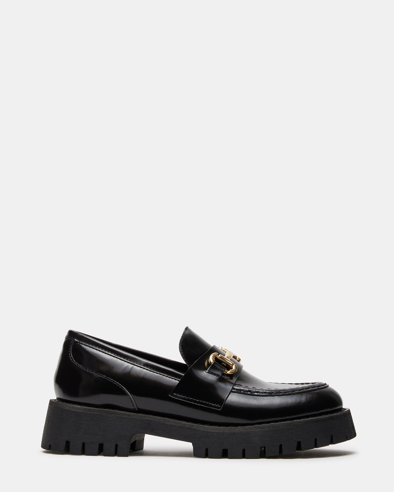 Black leather platform loafers with horsebit hardware showing the chunky sole detail