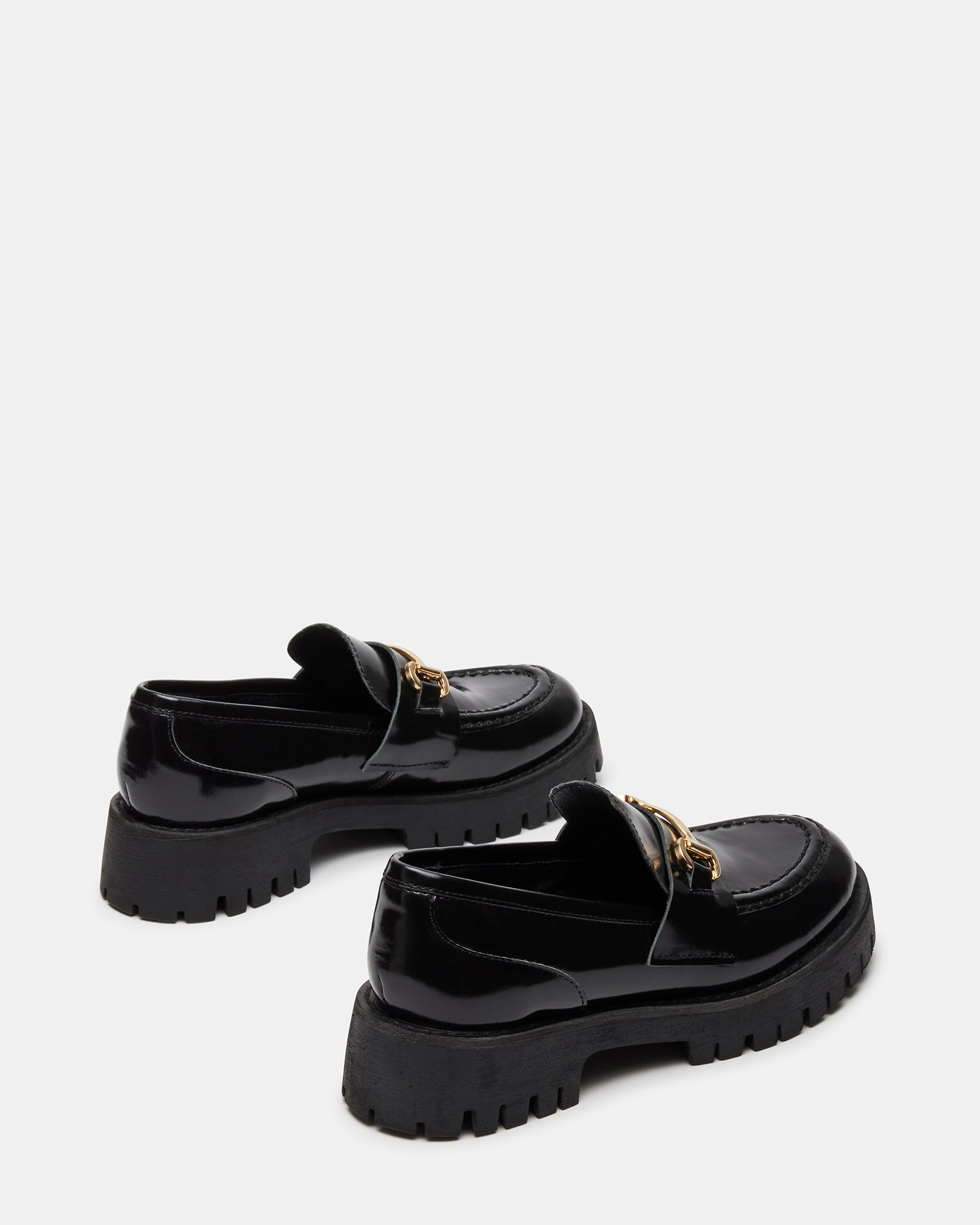 Side view of womens black platform loafers with classic hardware and lug sole