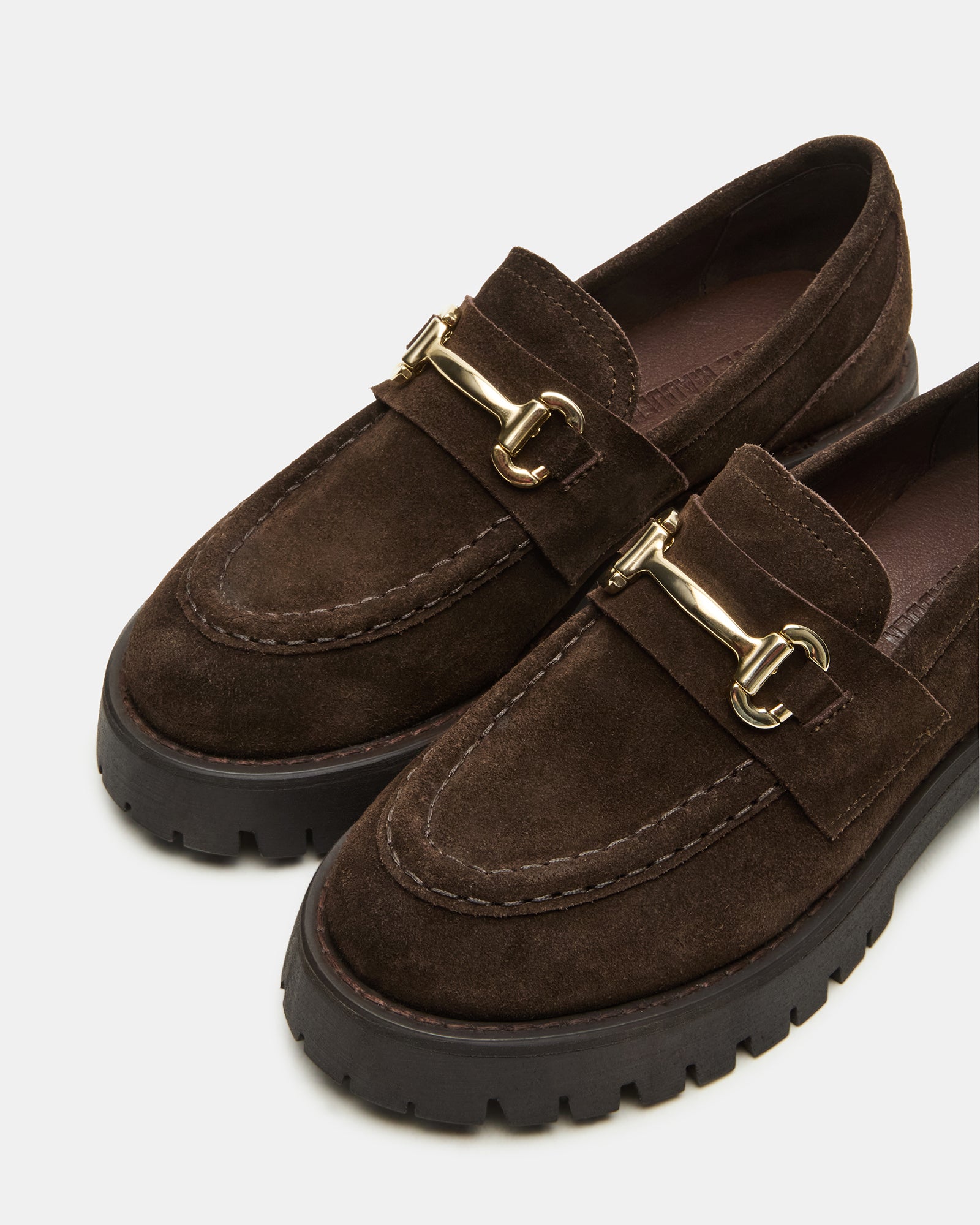 Brown suede platform loafers styled with jeans for a casual look