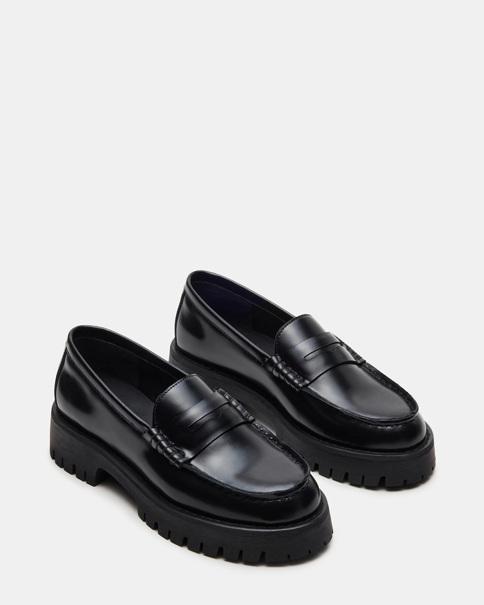 Black and white loafers styled with casual denim for an urban look