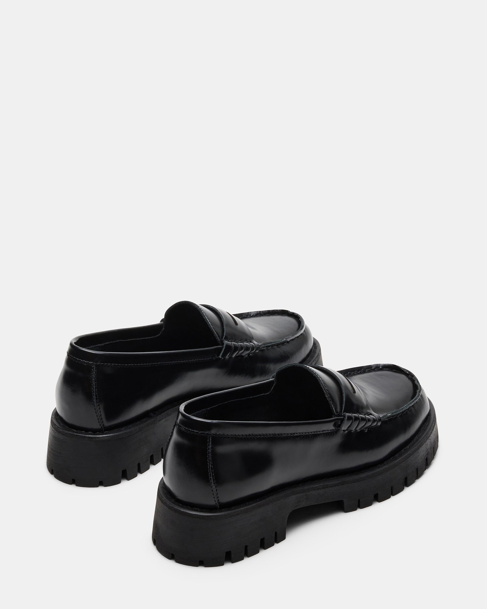 Black and white loafers styled with casual denim for an urban look
