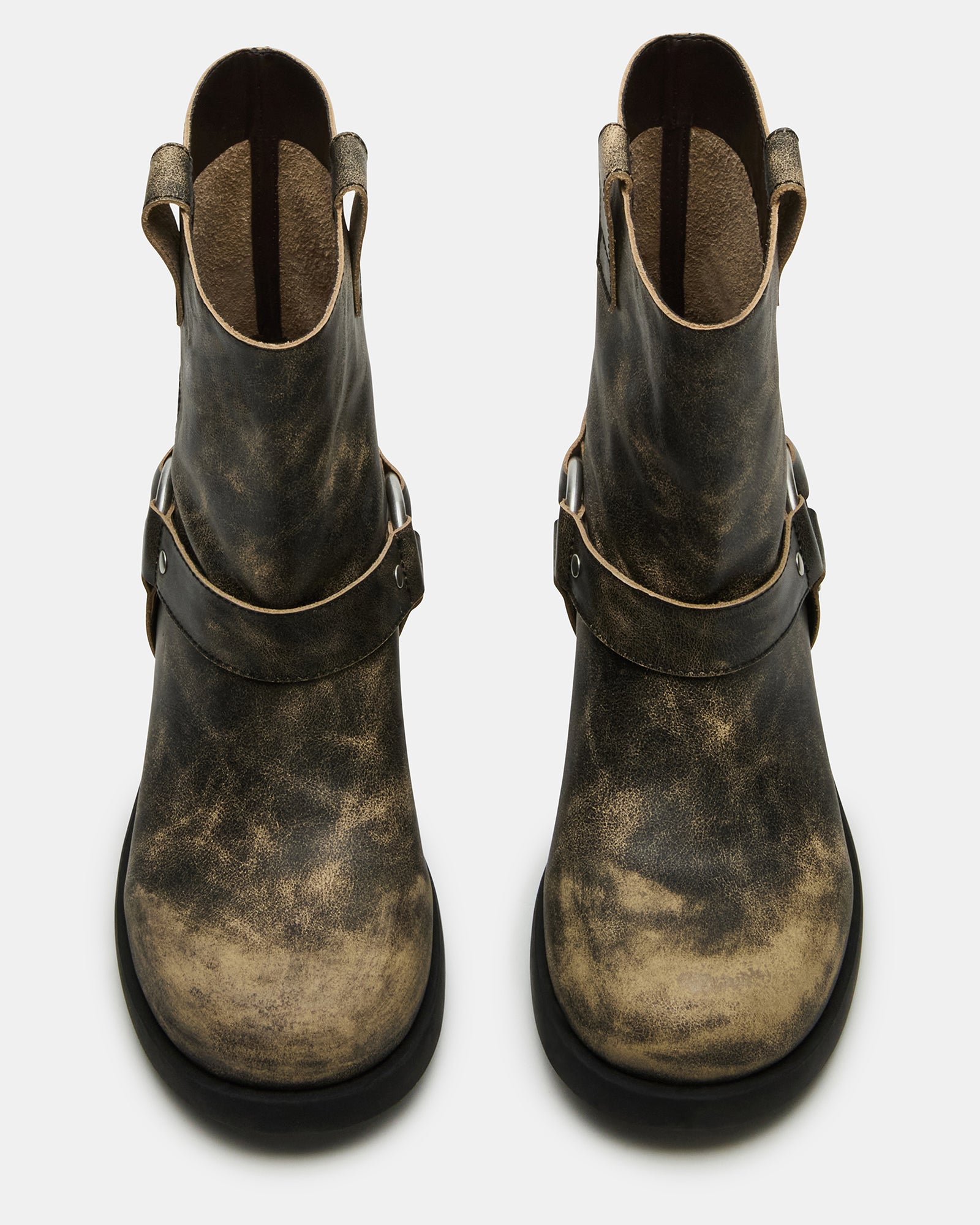 Side view of distressed boots showing heel height and ankle cut