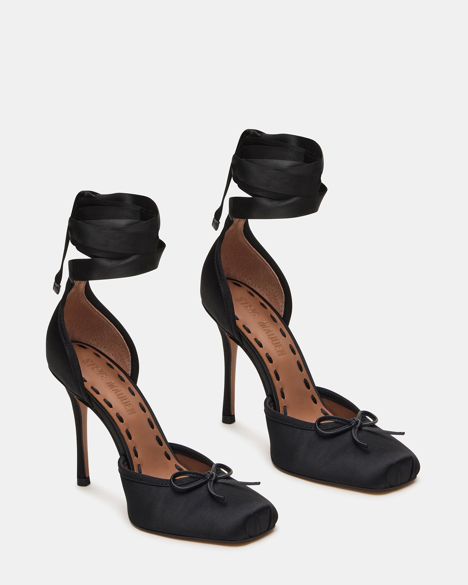 Side view of black high heel pumps ideal for formal occasions.