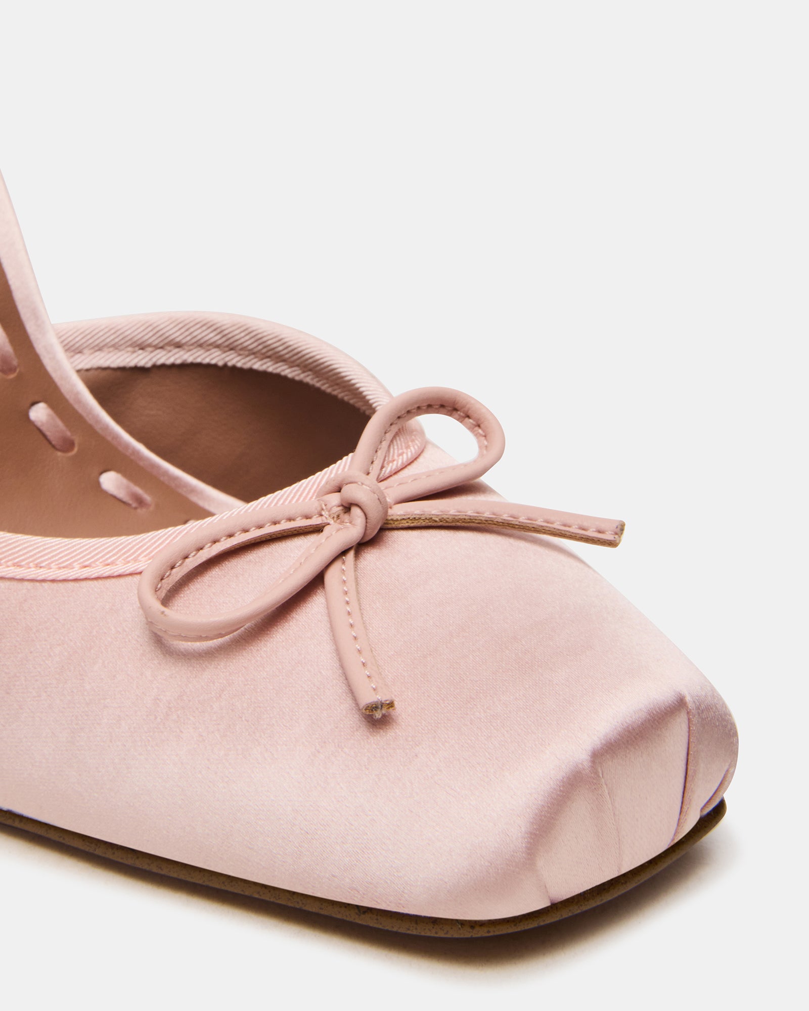 Overhead shot showing square toe and satin pumps detailing